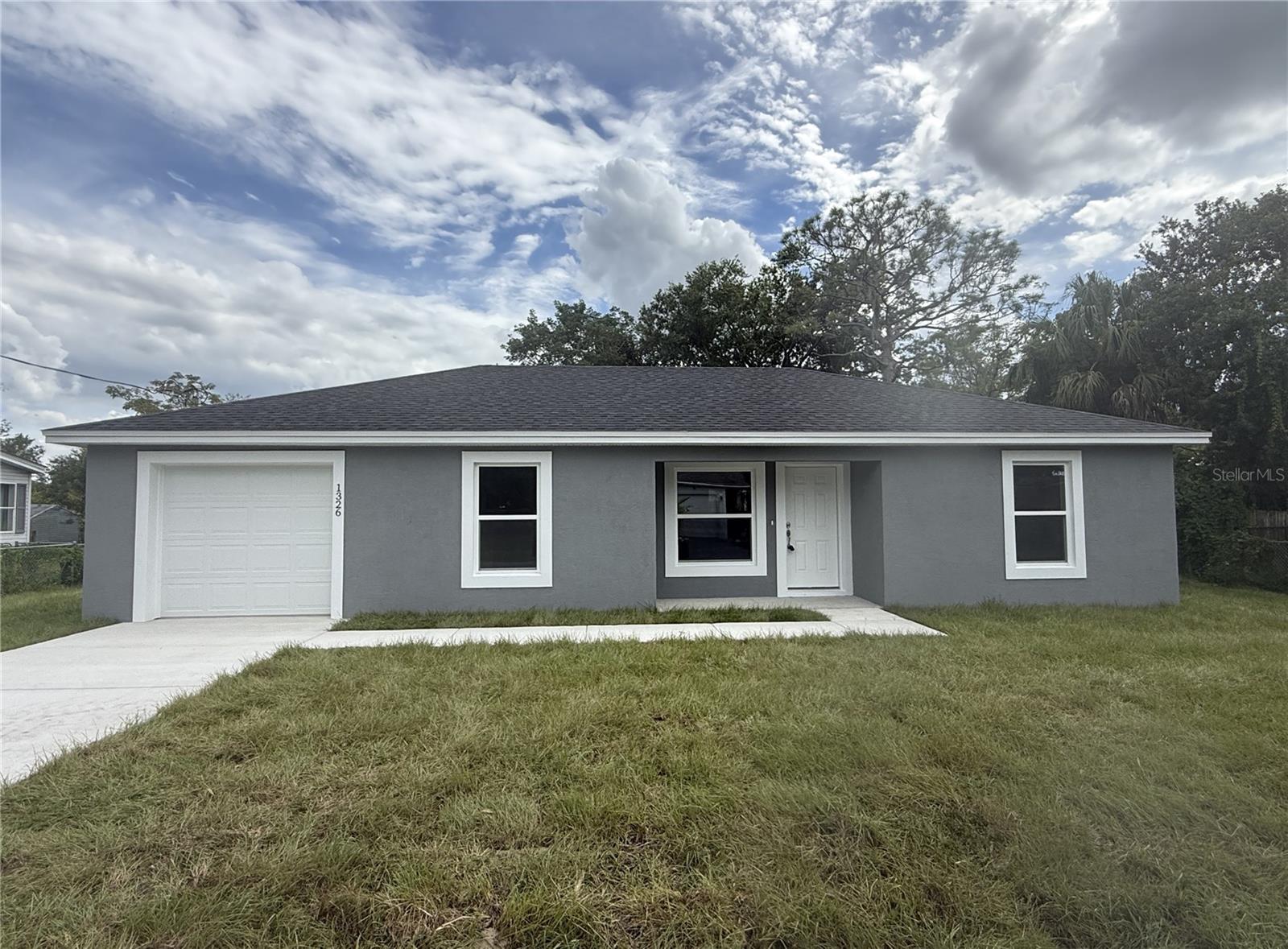 Brand New Construction! This stunning 3-bedroom, 2-bath home with a 1-car garage sits on a spacious 0.25-acre lot. Offering nearly 1,100 square feet of living space, featuring an open floor plan with split bedrooms! The kitchen boasts elegant granite countertops, modern cabinetry, stainless steel appliances, and a generously sized island, ideal for additional working space. Just off the dining area, you will find a large walk-in pantry for extra storage and French doors that open up to the backyard. Beautiful Luxury Vinyl flooring throughout the home for a stylish, low-maintenance finish! Washer/Dryer hookups are conveniently located in the garage. Enjoy the charming covered front porch—perfect for relaxing and unwinding. Don’t miss this opportunity— call and schedule your appointment today!