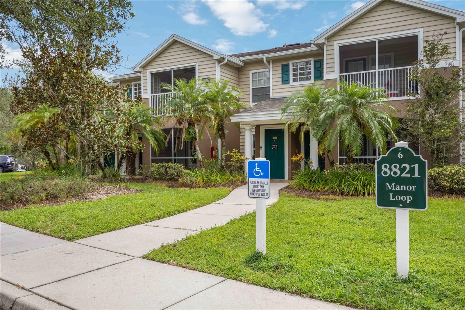 Welcome to The Village at Town Park! This 2 bedroom, 2 bath ground-floor condo features an open floor plan, wood-look flooring, and a spacious living/dining area. The kitchen offers plenty of counter space and a breakfast bar. The primary suite includes a walk-in closet and private bath, while the second bedroom and full bath are perfect for guests or a home office. Enjoy a screened lanai, in-unit laundry, and assigned parking. Community amenities include a pool, fitness center, clubhouse, and walking trails. Conveniently located near Lakewood Ranch Main Street, UTC, golf, dining, and Gulf beaches. Ideal for full-time living, a vacation home, or investment property.