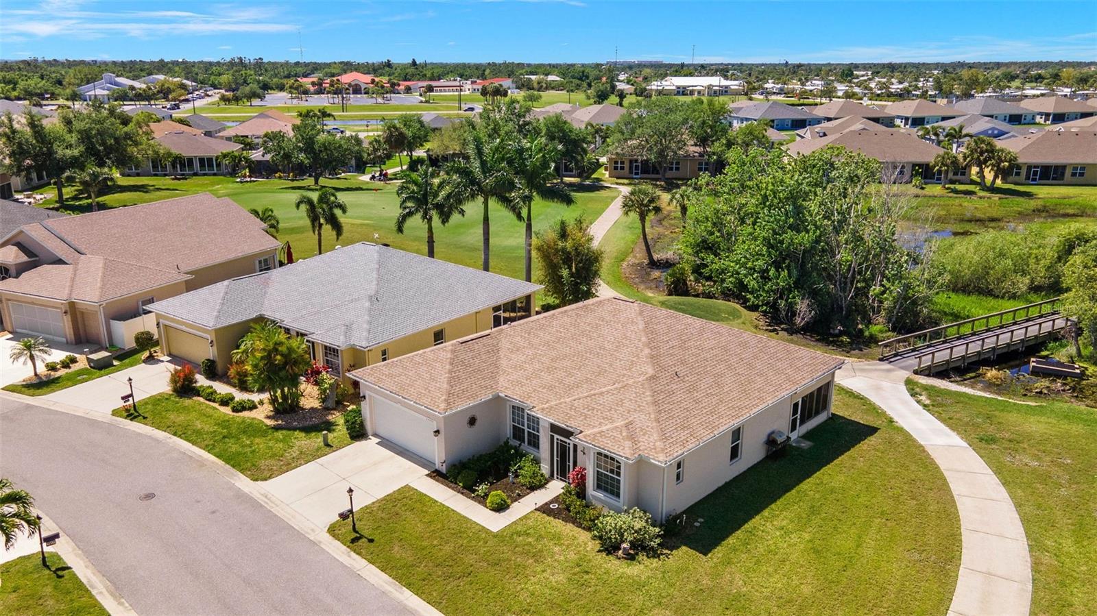 SENSATIONAL 2012 Bristol II home with IMPACT WINDOWS throughout the house and roll down hurricane shutters for the lanai in the gated golf course/active resort of highly desirable Kings Gate, a 55+ community (evacuation zone D - have not been under any evacuation order, more than 20 feet above sea level - storm surge has not been an issue, not in a flood zone - no flood insurance required). The Bristol II features high ceilings and several architectural features to make the home stand out. Located on a VERY LARGE CORNER lot you will have plenty of room to play corn hole, for your dog or what ever fits your lifestyle. House is situated near the 17th tee box/bridge and offers serene views of the trees and green. Step inside this extremely well maintained home and you'll notice the large living room briefly before your eyes are drawn to the MASSIVE lanai and that gorgeous view beyond. The lanai is enclosed by acrylic windows and protected by the electronic roll down shutters. The Bristol II is well liked for the split floor plan with the 2 guest bedrooms/bathroom located on the back left and the generous size master located on the back right of the home. The kitchen features plenty of counter and cabinet space with both eating space in the kitchen and a dining room adjacent to the living room. No question - you're going to spend quite some time in that lanai - enjoying your morning coffee and/or your favorite evening beverage overlooking nature. New Roof - acrylic windows and electric roll down shutters all in 2022. And if you haven't been to Kings Gate before - you're going to love the options for activity (Olympic size heated swimming pool and spa, tennis courts, pickle ball, lawn bowling, shuffle board, bocce, horseshoes, gym, billiards, library, euchre, bingo, bridge, Texas hold em, poker, mahjong and more). The onsite Lions Den restaurant and bar is super convenient and also offers Tuesday night Karaoke and monthly trivia contests. Many residents love the fact that they are just a golf cart ride away from the Winn Dixie shopping plaza that provides you access to grocery store, drug store, bank, restaurants and shopping. Want to explore outside of Kings Gate - your minutes away from the restaurants and shops of downtown Punta Gorda and Fisherman's village. And if you want to explore more of Florida's fun spots you’re near I75 to quickly head north or south. A well protected and maintained home with a massive lanai in a PREMIER gated community is a must see. Call today for a private showing and a golf cart tour of the community/amenities.