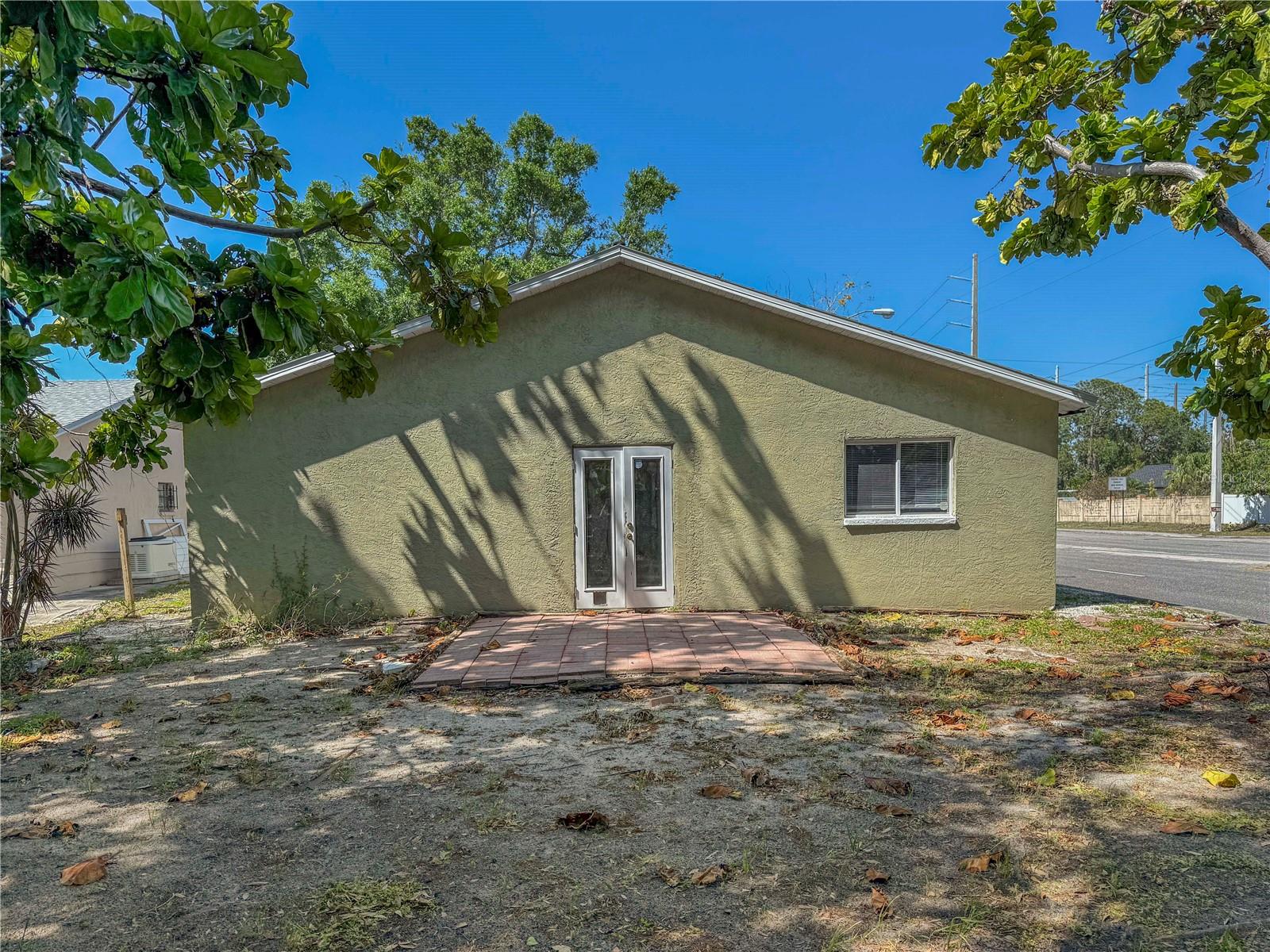 This is an updated 3 bedroom 2 bathroom home with an eat-in kitchen near Downtown Sarasota! The great room floorplan has tile laid on a diagonal with a combined living, dining and kitchen. The eat-in kitchen has a breakfast bar and granite countertops. The master bedroom has laminate wood flooring and an ensuite bathroom with a tub/shower combination. One of the spare bedrooms has laminate wood flooring and the other spare bedroom has tile and french doors that lead to the backyard. There is also a spare bathroom with a tub/shower combination. The kitchen and dining area provide access to the 1 car garage. The backyard is nicely shaded by large trees and is having a fence installed on 6/25/2025. This home is ideally located near downtown Sarasota and the renowned Ringling College of Art and Design. You'll be close to a variety of shopping, dining, and entertainment options in downtown Sarasota, as well as cultural landmarks like the Ringling Museum, Asolo Theatre, Marie Selby Gardens, St Armands Circle, and the historic winter home of the Ringling family. Tuttle Avenue north of Fruitville Road, turn west on 22nd Street. We score every application. If an application doesn’t score high enough, the resident may be required to place the equivalent of two months’ rent in a security deposit. Please be aware that leasing this property includes a non-optional Home Assistant Services Package that will cost an additional $30 per month. These services and their cost are separate from Tenant’s monthly rent payment and all other payments described in the Lease or any separate Lease addendums. The Home Assistant Services offered are described in the Resident Welcome Packet which can be viewed here: www.sarasotamanagement.com/home-assistant/