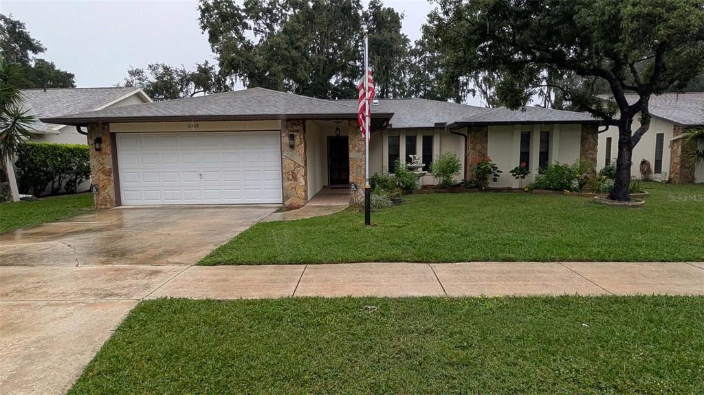 Photo of 12408 Golden Oak Circle, Hudson, FL 34669 (MLS # TB8557179)