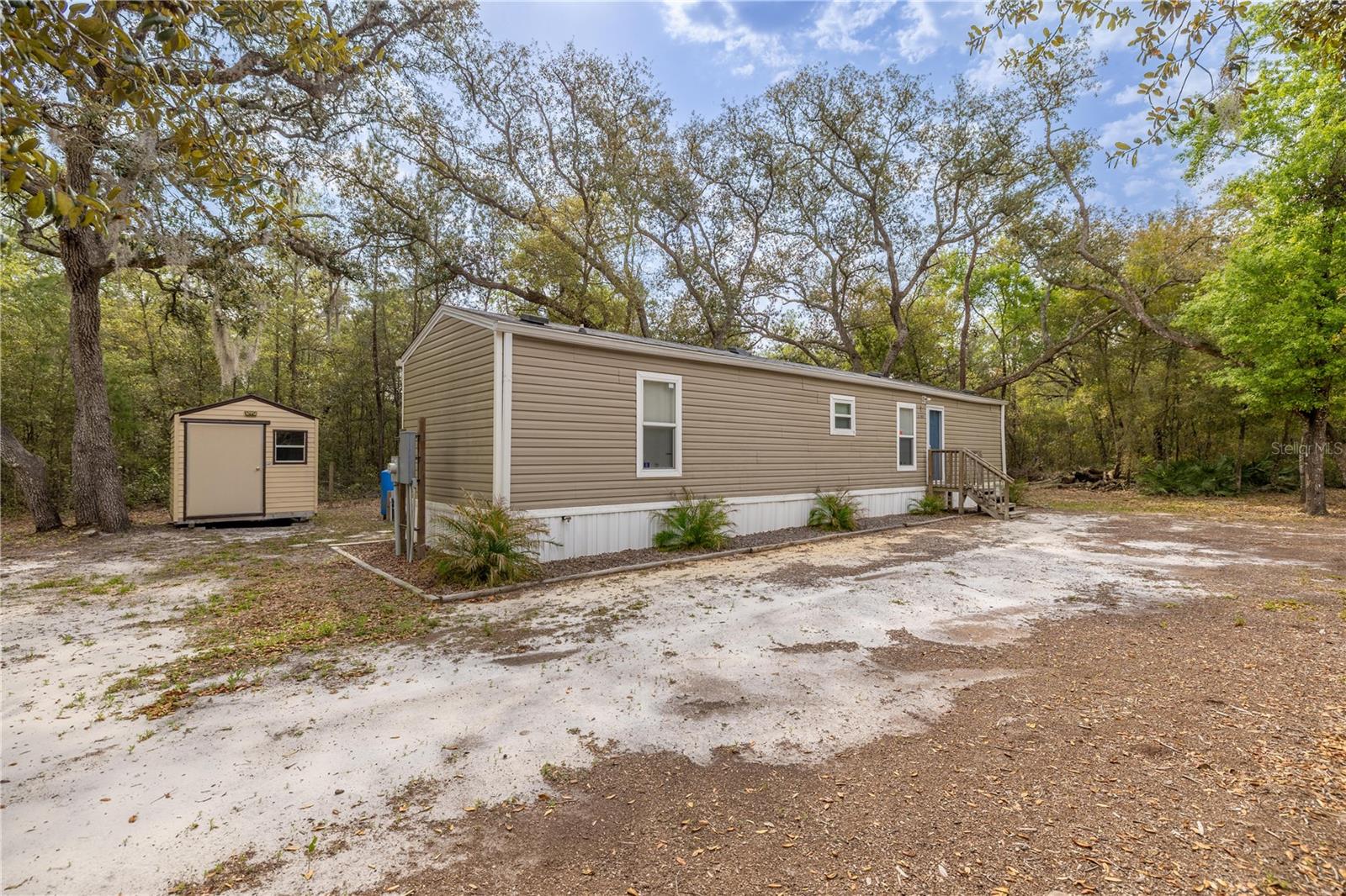 Welcome to this charming 2019-built mobile home, nestled on nearly half an acre of fully fenced property. Offering both privacy and space, this well-maintained home provides a peaceful retreat while still being conveniently located near the scenic Horseshoe Lake. Inside, you’ll find a comfortable living space, complemented by a whole-home water filtration system for added convenience. Whether you’re looking for a quiet getaway or a place to call home, this property offers the perfect blend of comfort, outdoor space, and accessibility to nature. Neighboring house is for sale, this makes for the perfect investment property or having family close by!