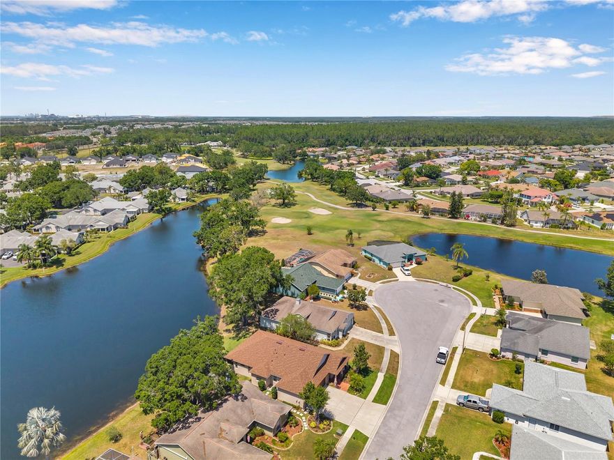 One or more photo(s) has been virtually staged. SELLER IS CONTRIBUTING $10,000 TOWARDS BUYER'S CLOSINGS COSTS/INTEREST RATE BUY DOWN. Welcome to your waterfront sanctuary in the exclusive Montero Village, a quiet cul-de-sac of just 12 custom homes nestled within the vibrant Sun City Center community; with no age restrictions here. This thoughtfully designed and custom-built home is a rare opportunity where refined details, modern upgrades and an unbeatable location come together seamlessly. From the moment you arrive, the stone front elevation and freshly sodded saint augustine grass makes a stunning first impression, setting the tone for the quality found throughout the home. Step inside to discover custom brickwork framing (btw- this is real brick which was personally set by the builder) the flat-top range and island, crown molding and bespoke trim work that add warmth and character to every room. With tray and 9-foot ceilings throughout, the home feels both open and inviting. Efficiency meets elegance with a new roof (2025), HVAC system (2021), radiant barrier insulation and dual-pane windows; providing comfort year-round. The expansive chef’s kitchen is perfect for everyday living and entertaining alike, offering premium finishes and a spacious, functional layout. The luxurious primary suite offers a true escape, complete with dual walk-in closets, dual sinks, a garden soaking tub and a spa-inspired dual-entry walk-in shower with dual shower heads. A separate Jack and Jill bedroom configuration adds privacy and convenience for guests or family. Outdoors, relax and recharge on the large screened patio overlooking the tranquil pond. The included swing is the perfect place to enjoy a quiet sunrise, a good book or a peaceful evening breeze. With an 8’ garage door, there's easy access for full-size vehicles or your golf cart which is perfect for exploring this golf cart-friendly community. Golf enthusiasts will love being just blocks from Cypress Creek Golf Club; be sure to visit their website for full membership details. Additional Features: Elegant woodwork and custom architectural elements throughout, conveniently located within 3 miles of all daily essentials and less than a half mile to i75. This is more than a home; it’s a lifestyle. Whether you're starting your day with coffee on the patio swing or winding down in your garden tub- this waterfront retreat is ready to welcome you home. Schedule your private tour today; this exceptional property won’t be available for long!