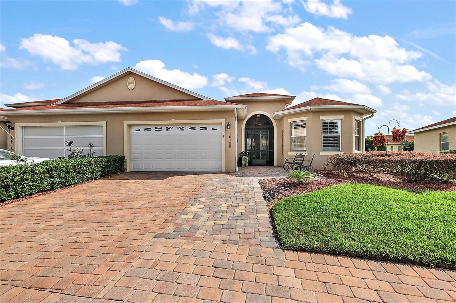 UNBELIEVABLE PRICE FOR THIS STUNNING VILLA LOADED WITH UPGRADES. Take advantage of this amazing price QUICK. Welcome to a one-of-a-kind home in Lakeside Landings, where luxury upgrades and meticulous attention to detail make this villa truly stand out. From the moment you arrive, you’ll notice the extra-wide paver driveway, elegant walkway, and screened entry with double leaded glass doors setting the tone for what’s inside. And with exterior maintenance and landscaping handled by the HOA, you can enjoy the beauty without the work!
Step inside and prepare to be WOWED. Soaring volume ceilings, 5.5” baseboards, designer light fixtures, upgraded ceiling fans, exquisite crown moldings (including double gold and champagne metallic accents), and luxury vinyl plank flooring throughout create a sense of elegance in every room. Plantation shutters and power shades add both beauty and convenience.
The living room is a showpiece, featuring custom architectural wood moldings and a tray ceiling, flowing seamlessly into the dining space. Off the living room, French doors open to a versatile office/den/bedroom (without a closet).
The kitchen is a chef’s dream – complete with wood cabinetry, custom pantry shelving, granite countertops, subway tile backsplash, stainless steel appliances, a farmhouse sink, and sparkling crystal lighting.
Retreat to the primary suite, where double walk-in closets maximize space and a luxurious en-suite offers marble shower, granite counters, dual vanities, and gorgeous upgraded fixtures. The guest bedroom and bath are equally impressive with matching upscale finishes.
Outdoor living shines with an expanded 10’x26’ lanai and birdcage, featuring molded epoxy flooring, electrical, irrigation, hose bib, power shades rated for 80mph winds, and even a dedicated dog area. The laundry room includes cabinetry, granite, and a bar sink, while the garage boasts epoxy floors, built-in cabinets, shelving, and overhead storage.
Peace of mind comes included with a NEW ROOF and an A/C that’s only 3 years old. This villa is practically brand new!
All this is in the sought-after 55+ section of Lakeside Landings, just outside The Villages and minutes from Lake Sumter Landing. Enjoy a gated, resort-style community with a stunning clubhouse, waterfall pool with beach entry, additional neighborhood pool, pickleball, tennis, basketball, fitness center, billiards, library, ballroom, and more.
Don’t wait – call today to see this exceptional villa before it’s gone! ACCEPTING OFFERS THROUGH SEPTEMBER 15th. ALL OFFERS WILL BE PRESENTED TO THE SELLER ON SEPTEMBER 15th.