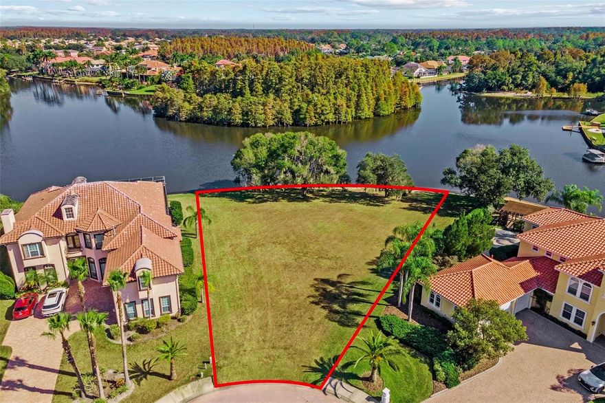 Discover an extraordinary .65 acre lakefront lot in the coveted Cory Lake Isles, offering over 200 feet of direct frontage on Cory Lake.  This rare homesite provides a serene, picturesque setting with sweeping open water views and breathtaking sunsets.  It's the perfect canvas for a luxury lakefront residence and located at the end of Bimini Isle cul de sac amongst other elegant custom-built Mediterranean homes. For boating enthusiasts, Cory Lake is a true paradise featuring a 165 acre ski lake for all your boating fun. Cory Lake Isles provides a perfect balance of luxury and leisure - ideal for those seeking an active, family friendly and waterfront community.  Residents enjoy access to a wide range of amenities, including *Two 24-hour guarded gates for security and peace of mind *A resort-style clubhouse with fitness center and event space *Heated community pool with waterslide and cabanas  *Tennis, basketball, sand volleyball, soccer field, outdoor roller hockey *Playgrounds and scenic walking and biking trails *Boat ramp and beach area for kayaking and boating.  Conveniently located near Bruce B Downs Blvd and I75, Cory Lake Isles offers quick access to top-rated schools, shopping destinations, premier medical facilities and major employment hubs.  Downtown Tampa and Tampa International Airport are both within a 30-40 minute drive.