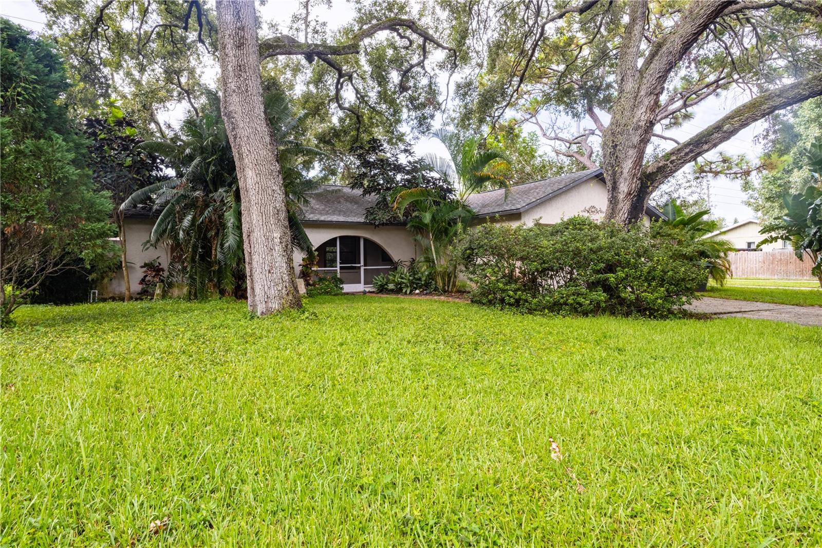 Come and discover this beautiful Cypress Point home in the heart of Clearwater! From the moment you hear the key turn in the door, you’ll know you’re unlocking “home”. Situated on a beautiful lot with a private backyard and tropical areca palms, the charming curb appeal foretells the feeling that great future memories will be made here. Upon entering, you will love the highly desirable open floor plan with vaulted ceilings and sliding doors that lead out to a large patio. The kitchen flows into the family room over a large center island and is complete with solar tube lighting for a light and bright atmosphere. Boasting of updated kitchen cabinetry and granite countertops, this center island will become the center of your family life for nightly homework projects, late night dinners and Saturday morning pancakes. Neutral color palettes flow through the entire home and the owners suite is generously sized with a large closet, a ceiling fan and an ensuite bathroom. Stepping into the backyard, it’s fully fenced for your furry friends and little ones alike. Plus, the patio area is ideal for your summer BBQ’s and sipping your morning coffee! Unexpected Extras Include: New HVAC 2022, Spacious 2 Car Garage with laundry and No Flood Insurance Required!!! Ideally located near the social ambiance area of downtown areas Dunedin, this home is also just minutes from America’s best sugary sand beaches. Do not delay ... Schedule your appointment today!