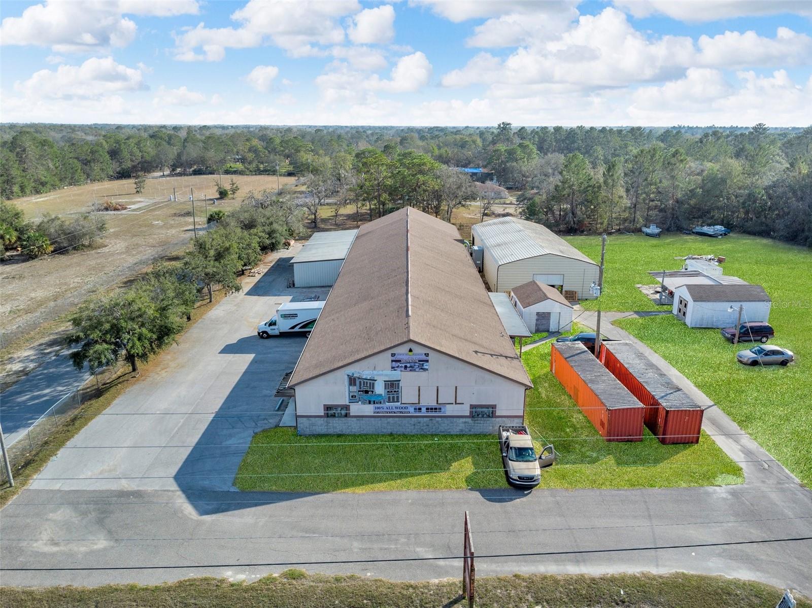 Under contract-accepting backup offers. Prime C-3 Commercial Property on Denton Ave. Exceptional opportunity to own 2.58 acres which is a fully fenced property with a sliding security gate for complete protection. 100+ parking space with ample land for future expansion. Including approx 14,368 sq. ft. MOL of Commercial Warehouses and is strategically located near the busy intersection of Denton Ave and Hicks Rd. This high-visibility location is ABOUT 1 mile from US HWY 19 and provides direct access to SR 52 & Suncoast Hwy. The property is zoned C-3, offering unlimited possibilities including manufacturing, distribution, storage, production and retail. The Main Building is (2,368 Sq. Ft.) Spacious open showroom/retail area which has a welcoming reception area for customer interactions, 2 large private offices for business operations and two bathrooms for added convenience. The Warehouse/Production Facility (8,000+ Sq. Ft.) has seven (7) roll-up garage doors (12 ft wide × 14 ft high) for seamless logistics with a 17 ft ceiling height, perfect for large-scale operations & is equipped with three-phase electric making for major power savings for industrial use. Warehouse has 2 additional bathrooms. The Large Metal Building (4,000 Sq. Ft.) has two (2) roll-up garage doors (12 ft wide × 14 ft high) Ideal for workshop, storage and or additional production space on a 6 inch concrete slab. There are also additional/separate sheds for added utility. Currently operating as a cabinet factory – Equipment available for sale separately. Endless Possibilities! Whether you're an investor, business owner, or developer, this high-visibility, high-traffic property offers incredible flexibility for: Manufacturing & Production / Warehousing & Distribution / Showroom & Retail Operations / Industrial & Commercial Storage. Call today to schedule your private showing!
