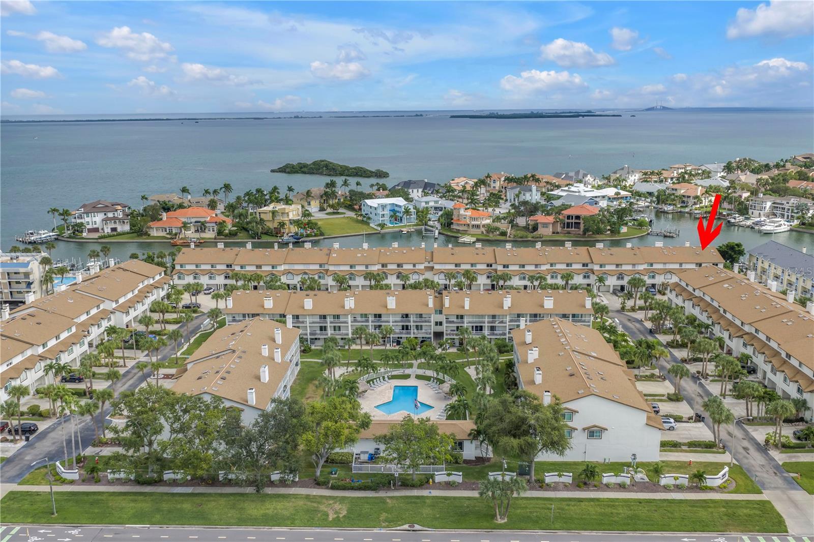 Welcome to the enclave of "Palms of Tierra," a vibrant townhome community nestled on the captivating island of Tierra Verde. Direct Waterfront End Unit provides lots of nautral light throughout. Truly "Move-In" ready. Tastefully updated interior brings the design of a Carolina Mountain Chalet but with the Coastal flare of Florida Sunshine and Waterways. Embrace a lifestyle of refinement and sophistication in this PET-friendly sanctuary (allows for 2 large dogs up to 100 lbs). Boasting a plethora of unparalleled amenities. Indulge in the opulence of a heated pool, invigorating spa, a great fitness center, serene fishing pier, tranquil docks and tennis courts, all within the embrace of impeccably landscaped grounds. Elegance and comfort intertwine seamlessly within this amazing townhome. Radiating an ambiance of timeless charm, this light-filled residence welcomes you with its airy design and sumptuous appointments. Adorned with easy-to-maintain hardwood flooring, the living spaces exude a sense of effortless grace, perfect for entertaining guests or simply unwinding in style. The main level epitomizes the concept of open-plan living, featuring a spacious great room adorned with a corner wood-burning fireplace, offering a seamless flow to one of the balconies overlooking the canal and your private BOAT SLIP with 13,000 lb lift.. The kitchen comes with all the appliances, complete with a breakfast bar, ensures effortless serving while hosting gatherings. A tastefully appointed bedroom and updated bath on this level add to the allure of this distinguished residence. Ascend to the upper level to discover a sanctuary of tranquility in the primary suite, complete with an ensuite bath and shower. The indulgent primary bedroom opens onto a second balcony, offering enchanting vistas of the waterway. An additional bedroom with ensuite bath, featuring a shower/tub combo and skylight, completes this level, providing a haven of comfort and luxury. The expansive 48-foot long garage, accommodating two cars tandem, grants ample space for your vehicles, with convenient access to the back patio. Further enhancing your lifestyle is the inclusion of "peace of mind" features such as a newer A/C unit and IMPACT windows and sliding glass doors. Experience the epitome of resort-style living with the lavish amenities of Palms of Tierra, encompassing cable TV, internet, ground maintenance, heated pool and spa, tennis courts, fishing dock, waterfront boardwalk, and a well-equipped fitness center. Additionally, HOA fees cover water, sewer, and trash services, ensuring a carefree lifestyle. Beyond the confines of this exclusive community, Tierra Verde beckons with a wealth of culinary delights and recreational pursuits, including pristine beaches at Fort DeSoto Park and St. Pete Beach, as well as renowned dining establishments and cultural attractions in downtown Saint Petersburg. Easy access to I-275 and Tampa International Airport further enhances the convenience of this exceptional location, offering a truly unparalleled living experience. Indulge in a relaxed lifestyle provided to you living at Palms of Tierra – where every moment is infused with beauty and relaxation.