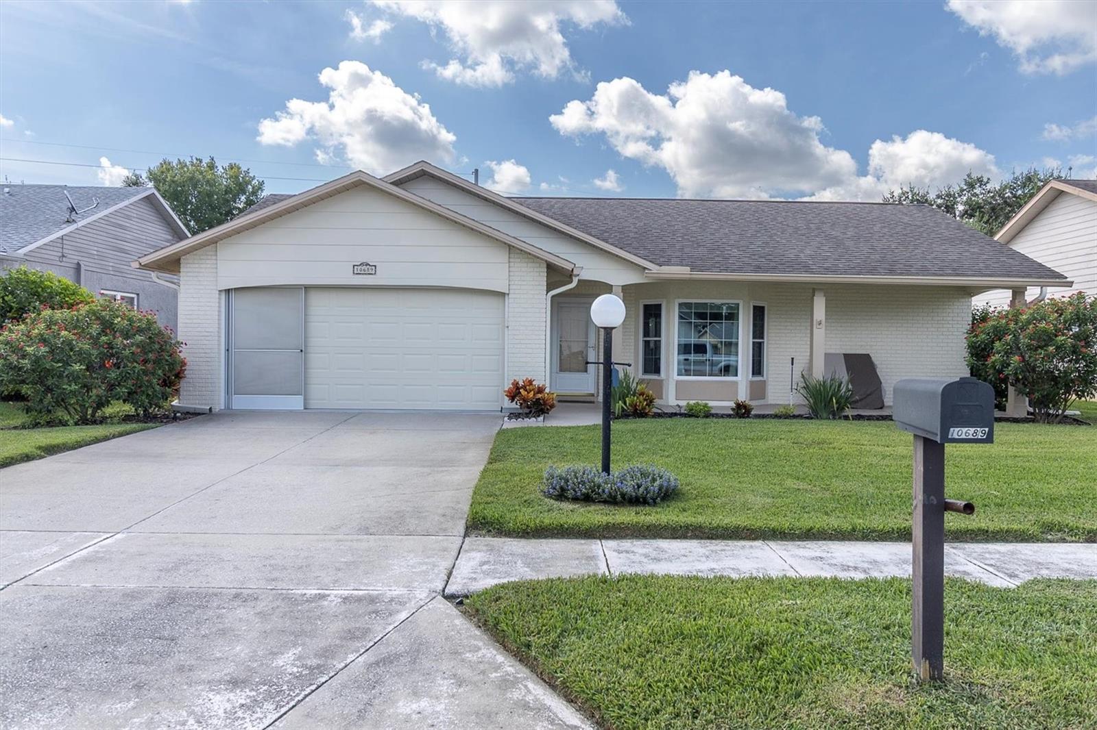 SPECTACULAR DOES NOT SAY ENOUGH ABOUT THIS GORGEOUS 2/2/2 IDEALLY LOCATED IN ONE OF THE AREAS MOST POPULAR AND AFFORDABLE ADULT COMMUNITY'S ON A CONSERVATION LOT WITH NO REAR NEIGHBORS. IF YOU HURRY YOU CAN REAP THE BENEFITS OF THE TENS OF THOUSANDS OF DOLLARS THE SELLER HAS INVESTED IN EXTRAS & UPGRADES! ALL NEW HURRICANE WINDOWS ON THE MAIN HOME, TOP OF THE LINE NEW HVAC WITH WHOLE HOUSE FILTRATION SYSTEM & NEW DUCT WORK, EXTRA ATTIC INSULATION HAS ALSO BEEN ADDED AS WELL. THE LIVING ROOM, FORMAL DINING ROOM ARE ACCENTED WITH ELEGANT CHAIR RAIL. THE CUSTOM KITCHEN IS DESIGNED FOR A CHEF! ENJOY A BIG DOUBLE DOOR PANTRY, LOADS OF CABINETS & QUARTZ COUNTER TOP WORKSPACE GLEAMING STAINLESS APPLIANCES, THE SEPARATE CABINET AREA IS ENHANCED WITH A WINE FRIDGE PERFECT WHEN ENTERTAINING! THE BREAKFAST COUNTER BAR OPENS TO THE FAMILY ROOM FLOODED WITH LIGHT AND GREEN VIEWS! THE LARGE FLORIDA ROOM HAS HVAC AND PROVIDES EXTRA LIVING SPACE FOR YOUR HOBBIES, CRAFTS OR HOME OFFICE. THE SPLIT FLOOR PLAN GIVES MAXIMUM PRIVACY TO THE PRIMARY SUITE; IT FEATURES UPGRADED PRIVATE BATH WITH GORGEOUS NEUTRAL DECOR; LOVE THE BIG WALK IN CLOSET! THE GUEST BEDROOM ALSO HAS A BIG WALK IN CLOSET AND IS ADJACENT TO THE UPGRADED GUEST BATH! LOVE THE CONVENIENCE OF THE INSIDE LAUNDRY ROOM. THE OVERHEAD HURRICANE GARAGE DOOR IS NEW AS IS THE OPENER AND HAS SCREENS; AN EFFICIENT HYBRED WATER HEATER, WATER SOFTNER, NEW GUTTERS, NEW WELL PUMP FOR THE SPRINKLER SYS KEEPS THE LANDSCAPING LUSH! NOTHING HAS BEEN OVERLOOKED! THIS COMMUNITY SITS HIGH & DRY FEATURING AN ACTIVE LAKESIDE CLUBHOUSE THAT OFFERS HEATED POOL & SPA, EXERCISE ROOM COMPLETE WITH TONS OF EQUIPMENT, TENNIS CTS, DANCES, PARTIES, MORE THAN FUN AND ACTIVITES THAN YOU WILL EVER BE ABLE TO KEEP UP WITH! HOMES LIKE THIS ARE REALLY HARD TO FIND ESPECIALLY AT THIS RAZOR SHARP PRICE! YOU BETTER HURRY TO MAKE IT YOURS! HESITATE... AND YOU'LL BE TOO LATE!