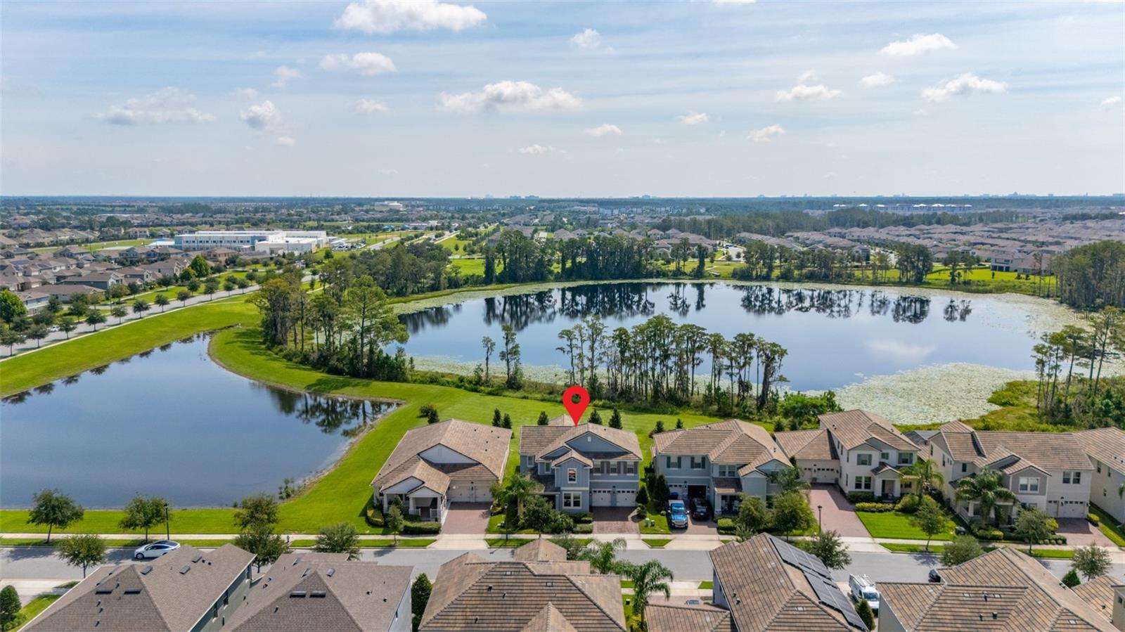 The lakefront life of grandeur awaits you in this stunningly enhanced North Haven model by DR Horton's luxury line, Emerald Homes! Structural enhancements are plentiful and include a Control4 Smart Home Automation System, custom designed closets in nearly every closet throughout the home, security system, technology operated window treatment, entire home water softener, reverse osmosis kitchen faucet, recessed lighting, tile roof for added longevity, and more! Admire the curb appeal as you walk up to your covered front porch by way of the sealed brick paver sidewalk amidst luscious landscaping maintained entirely by the HOA. Relish in the wood plank tile that floor most of the downstairs for a highly desirable look as well as ease of maintenance. To the right of the entrance is a flex space (named the formal dining room by the builder) ready for you to make of it what you want. Continue into the main living space and soak in all of the lake views through the many windows on the back of the home. The gourmet kitchen is also in this open concept space for taking in the lake views, and it is truly a home chef's dream being lined with tons of cabinetry and countertop space. The dining space is right off the kitchen overlooking those beautiful lake views. The primary suite is tucked away privately in the back of the home downstairs and contains even more opportunities for lake viewing. A tray ceiling and custom designed closet make this space even more admirable. The en suite showcases a split dual vanity, massive walk-in shower, and a garden tub that all overlook the lake. Head upstairs via an upgrade staircase lined with wrought iron spindles and luxury vinyl flooring. The loft greets you with endless opportunities of how to customize this space for your enjoyment. A ceiling-mounted projector and theater screen are included with the sale. More windows allow in natural lighting as well as the views of the lake. A Jack-and-Jill bathroom connect bedrooms 2 and 3, and both rooms feature custom designed closets. Bedrooms 4 and 5 are also upstairs and adorned with custom designed closets, and their bathroom is outside of the bedrooms and houses a dual vanity with separate water closet. Head out back where your gargantuan backyard extends from the house to the edge of the waters of Lake Ihrig. Relish in the fact that the HOA maintains this entire extended backyard so you have even more time to enjoy this outdoor space that is extremely rare in Horizon West. The tandem 3-car garage efficiently utilizes every opportunity for space. Situated in the back of the community, you truly get the best of both worlds by enjoying the peace and quiet yet also being a short walk away from the vast amount of amenities, A-rated schools, and the shopping plaza. Waterleigh is building out its final phase, and the Emerald Series is no longer offered making this an even more unique and special opportunity. Inquire today on how to make this gem your own!