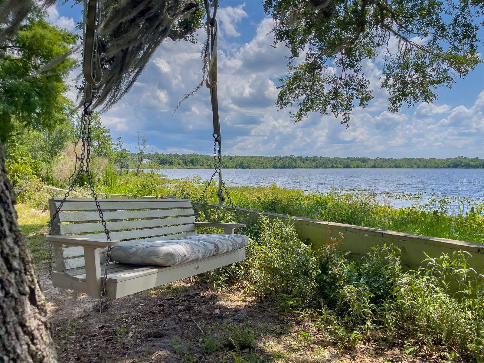 Lakefront Living at Its Finest – 3BR/3BA Home on North Lake Discover unparalleled waterfront living in this distinctive 3-bedroom, 3-bathroom home
nestled on the serene shores of North Lake in beautiful Silver Springs, FL. Boasting 110 feet of private lake frontage, this residence offers a rare and
spacious layout, perfect for those seeking tranquility and ample space.
Property Highlights: Unique Floor Plan: Designed for comfort and versatility, this home features an open-concept living area with expansive windows
that frame breathtaking lake views.
Private Lake Access: Enjoy direct access to North Lake, ideal for fishing, boating, and leisurely lakeside relaxation.
Attached Garage & Sheds: Includes a one-car Attached garage with a private entrance, offering additional storage or workspace.
Two spacious sheds provide ample room for tools, equipment, or hobby space.
RV Pad behind the Sheds for potential Guest.
Additional Living Space: An attached room with its own bathroom offers potential for a guest suite, home office, or studio.
Outdoor Amenities: The expansive yard provides ample space for outdoor activities, gardening, or future expansion. This exceptional property
combines the charm of a unique floor plan with the beauty of lakeside living.
Whether you're seeking a peaceful retreat or a home with room to grow, this North Lake gem offers endless possibilities.