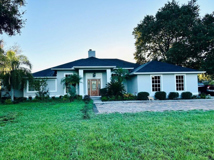 Exquisite 4-Bedroom Estate with Pool on 2+ Acres in the Coveted Longwood–Lake Mary Area, and no HOA. 
Experience refined living in this fully renovated 4-bedroom, 3-bath residence, perfectly situated on 2.06 acres of lush, gated grounds in one of Central Florida’s most desirable areas. Offering 2,333 sq. ft. of interior space, this exceptional property combines modern elegance with serene, estate-style living — all just minutes from premier shopping, dining, and I-4 access.
The chef’s kitchen showcases quartzite countertops, modern cabinetry, and a bright breakfast nook overlooking the family room. Enjoy both formal and casual entertaining with a spacious living room, dining room, and open-concept layout enhanced by high ceilings and abundant natural light.
The expansive primary suite is a true retreat, featuring a walk-in closet and a spa-inspired en-suite bath adorned with porcelain ceramic tile and a frameless glass shower. Each of the home’s additional bathrooms has been meticulously updated with high-end materials and thoughtful design.
Outdoors, your private sanctuary awaits. A resort-style pool serves as the centerpiece, surrounded by 8,000 sq. ft. of pavers, manicured landscaping, and a new, fully integrated irrigation system. The property is fully fenced and secured by an electric gate for privacy and peace of mind. Additional upgrades include a new roof (2022), and a tankless water heater, ensuring modern efficiency and comfort. The home also benefits from a private well and a Kinetico water filtration system for superior water quality.
Originally conceived as an equestrian estate, the property features four horse stalls, a feed room, and a shower pad, offering endless possibilities for horse enthusiasts. Currently enjoyed as a mini farm, the grounds boast 30 fruit trees, two thriving gardens with squash and watermelons, and ample open space for outdoor recreation.
Blending timeless sophistication with contemporary convenience, this remarkable property offers a rare opportunity to own a private luxury retreat in the heart of the Longwood–Lake Mary corridor — where elegance meets acreage. Schedule your showing today!