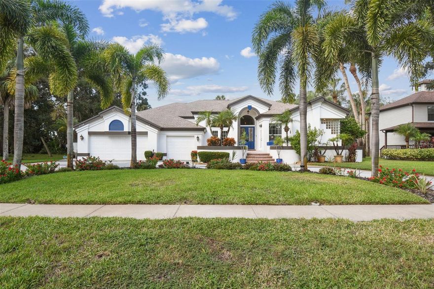Welcome to this custom ALL CONCRETE BLOCK CONSTRUCTION 4 bed, 3 bath home in the gated community of Meyers Cove! Perfectly located in a private cul-de-sac, this home includes a PERSONAL DOCK (slip #20), 16,000 lb boat lift, & direct access to the Gulf of Mexico. Built in 1989 with 3,826 heated sq ft, this home has never flooded.  A staircase leads to a charming front courtyard that offers tropical beauty & privacy. Inside, the formal living room features real wood floors, a propane fireplace, & 3 sliding glass doors that open to the expansive patio. To the left is a formal dining room w/ French doors to the courtyard, accented by stair-stepped plant shelves & dramatic lighting. To the right, a private office also includes French doors! The spacious master suite is a true retreat with granite tile floors, dual closets, & an elegant en suite bath. Highlights include transom windows, a coffer ceiling with accent lighting, a private water closet with both standard & bidet toilets, a granite walk-in shower, whirlpool tub, floating solid wood cabinets w/ underlighting, granite countertops, oversized mirrors with crown molding, & a TV viewable from the tub. Off the master is a versatile bonus room w/ wood floors, French doors, & a private patio exit—great for a second office, home gym, or sitting room. The nearby powder bath impresses with a granite vessel sink, waterfall faucet, & stylish vanity. The kitchen has been beautifully updated with newer soft-close cabinets with frosted glass panels, a double oven, 6-burner gas stove, stainless steel fridge, Level 5 granite, double sink, a huge walk-in pantry, & jellyfish accent lights. Ceiling & under-cabinet lighting complete the space. An adjacent eat-in nook opens to the back courtyard via sliding glass doors. The family room boasts wood floors, plantation shutters, another propane fireplace with marble surround & floor-to-ceiling columns, plant shelf lighting, & a built-in bar with granite, sink, refrigerator, & custom cabinetry. A full guest bath includes a floating vanity, quartz countertop, walk-in shower, & soaking tub, with direct backyard access—ideal for future pool plans. Electric & plumbing stub-outs are already in place. 3 spacious bedrooms are located down the hall, each with plush carpet, ample closets, & room for king beds. One even includes private patio access, making it perfect for a guest or in-law suite. The backyard is an entertainer’s dream with a lush tropical oasis, built-in firepit, paver walkway, fully fenced yard, & a covered patio with skylights & wood-lined ceilings. Multiple sliding glass doors (including 3 from the living room, four from the kitchen, & two from the master) tuck away into the walls for seamless indoor-outdoor living. A pass-through kitchen window adds ease for outdoor entertaining. The oversized laundry room includes cabinets, extra fridge, utility sink, & access to the 3-car garage with 8’ doors, 12’ ceilings, Tesla hookup, attic access, side door, & central vacuum. This home is also solar-ready. Additional highlights: New flooring, granite surfaces, new porch railing, smart lighting system (Alexa-controlled), hurricane shutters, & a brand-new roof to be provided by the seller. Low HOA fees cover gated entry, dock, & common area maintenance. Current Flood Insurance is $900/year. (documentation available). Enjoy the best of waterfront living on the Anclote River with quick Gulf access. Walk Through Video attached, click Virtual Tour!