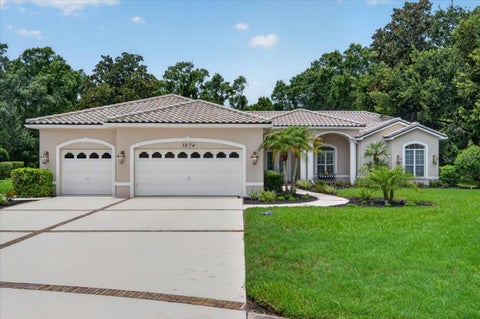 Photo of 3874 Crescent Cove Place, Tarpon Springs, FL 34688 (MLS # TB8528562)