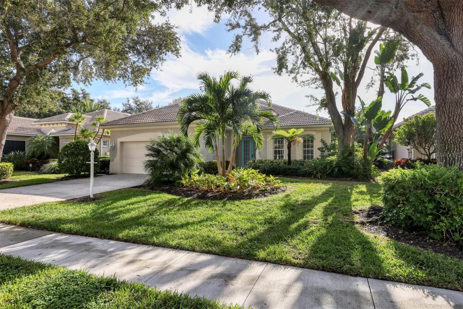 Private Pool Single Family Home Next to IMG Academy: Fully furnished, maintenance free, charming, filled with natural light, two-bedroom, two-bathroom plus den and a two-car garage. At almost 2,200sq ft, this home is nestled in the desirable and beautifully landscaped The Greens at El Conquistador neighborhood. The home offers tall, coffered ceilings throughout the main living area and a comfortable open floor plan with split bedrooms. The large and spacious primary bedroom with a high tray ceiling, has a bathtub, walk-in shower and expansive walk-in closet. The second bedroom and guest bathroom, together with its tiled walk-in shower, are off the main entrance. The den is outfitted with a brand-new sleeper sofa for your guests. A generous-sized eat-in kitchen with stainless steel appliances and granite counters opens up to your private oasis consisting of a screened in patio with a heated pool and hot tub. There is also a laundry room with a full-sized washer and dryer. Just minutes to Publix, Target, Home Goods, First Watch and Starbucks. Twenty minutes to the beaches on Longboat Key and Anna Maria Island as well as to downtown Sarasota and its incredible dining options. Electricity (up to $250.00/month), water (up to $100.00/month), sewer, garbage collection, internet, basic cable, and pool/yard maintenance included with rent. The stated rate is for a lease of at least 6 + months. The rate for a 3–6 month lease is $6,500/month plus applicable short-term fees/taxes. First month’s rent, last month’s rent and security deposit required to reserve. Schedule your tour today!