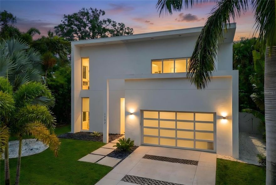 Welcome to modern West of Trail living — where space, style, and location come together in one of Sarasota’s most desirable family neighborhoods. Designed for the buyer who wants room to grow without sacrificing lifestyle or convenience, this stunning newer construction home offers the perfect balance of luxury, functionality, and everyday ease.

From the moment you arrive, the quiet, tree-lined streets and classic white-picket-fence charm of the neighborhood set the tone. Surrounded by multi-million-dollar homes and a true community feel, this is the kind of place where families ride bikes in the evenings, walk to school, and enjoy a relaxed yet refined Sarasota lifestyle.

Step through the front door and into a dramatic, light-filled foyer that immediately showcases the home’s modern aesthetic and open, airy design. Soaring ceilings, sleek lines, and expansive glass create a sense of volume and energy, while the open-concept floor plan delivers the flexibility today’s families need. The main living space flows effortlessly into a designer kitchen featuring an oversized island, premium appliances, custom cabinetry, and abundant storage — ideal for casual family dinners or entertaining friends.

With five bedrooms plus a dedicated office and a spacious bonus room/loft, this home was designed around real life. Whether you need guest space, a media room, playroom, or homework zone, there is room for everyone to spread out while still feeling connected. One of the most unique features is the flexibility of having a choice of a primary suite on the first or second floor, making the home ideal for multi-generational living, long-term flexibility, or simply choosing the layout that best fits your lifestyle.

Outside, the lifestyle continues. The heated pool and outdoor kitchen create an effortless indoor-outdoor flow perfect for weekend gatherings or quiet evenings at home. Unlike many tropical properties, the landscaping is intentionally low-maintenance, giving you the beauty of a resort-style setting without endless upkeep — more time enjoying, less time working.

Built above the flood plain, this home offers an important advantage for peace of mind and long-term savings: no flood insurance required. Modern construction standards, quality materials, and hurricane-rated features ensure durability and efficiency for years to come.

Location is everything, and this one is hard to beat. Walk to highly rated Southside Elementary and the boutiques and restaurants of Southside Village. Enjoy dinner just a block away at some of Sarasota’s most loved restaurants. Spend your weekends at Siesta Key Beach or downtown Sarasota — both just about eight minutes away — then return home to a quiet, suburban setting that feels private, safe, and unmistakably family-friendly.

This is more than just a beautiful modern home — it’s a lifestyle designed around space, comfort, and connection in one of Sarasota’s most coveted neighborhoods. If you’ve been searching for a move-in-ready home with bedrooms to spare, a pool, modern design, and a location that checks every box, this is the one.

Schedule your private showing and experience West of Trail living at its best.