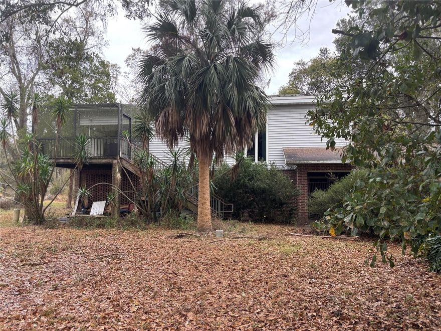 This property is great for someone looking to design their dream home on a nice piece of property. The present home could be remodeled or redesigned. There is a large working shed/shop on the property, which would serve well for garden or farm equipment or a workshop.