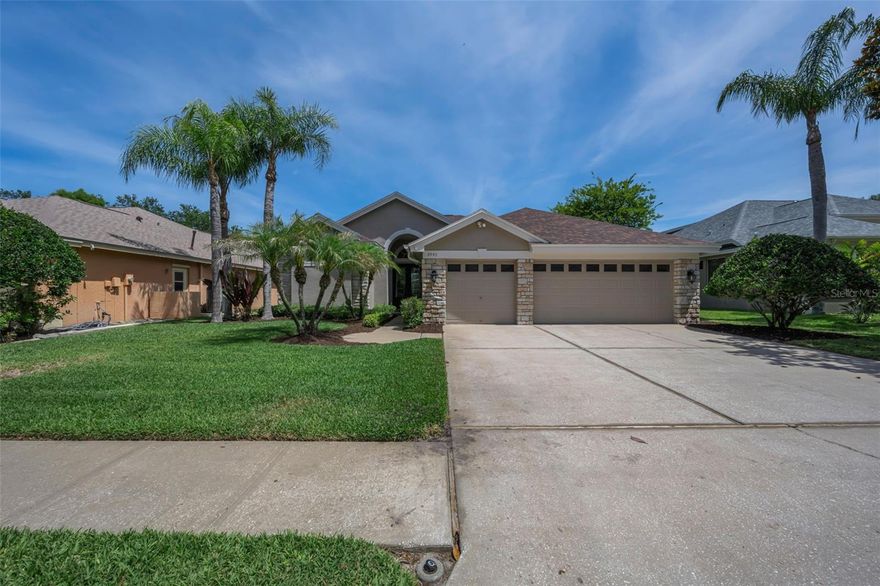 Welcome to this spectacular Nohl Crest built 4- bedroom, 3- bath, 3- car garage pool home located in the highly desirable "Northfield "neighborhood within the "Lansbrook" community of North Pinellas! This beautifully maintained home offers a sought-after three-way split floor plan perfect for families and guests alike. Inside, you’ll find numerous updates including LVP flooring though out the home, hall baths with new vanities, kitchen cabinetry, quartz counter tops and lighting, baseboards, and more.
The spacious primary suite features a large bedroom with private sliders out to the pool, his and her closets, dual vanities, a relaxing soaking tub, and a walk-in shower. Two secondary bedrooms share a hall bath, while a private fourth bedroom and bath are tucked away at the back of the home, making it an ideal guest or in-law suite.  Step outside to your own tropical retreat with a sparkling pool overlooking the pond, creating the perfect setting for relaxing or entertaining. Additional highlights include a roof replaced in 2021, beautiful landscaping, and true pride of ownership throughout this well-cared-for home.  Lansbrook residents enjoy an incredible lifestyle with access to private boat docks and a boat ramp on beautiful Lake Tarpon, two community parks, scenic walking and biking trails throughout the neighborhood, basketball courts, playgrounds, and so much more. Conveniently located close to top-rated schools, shopping, dining, and the beautiful Gulf beaches, this home truly has it all!