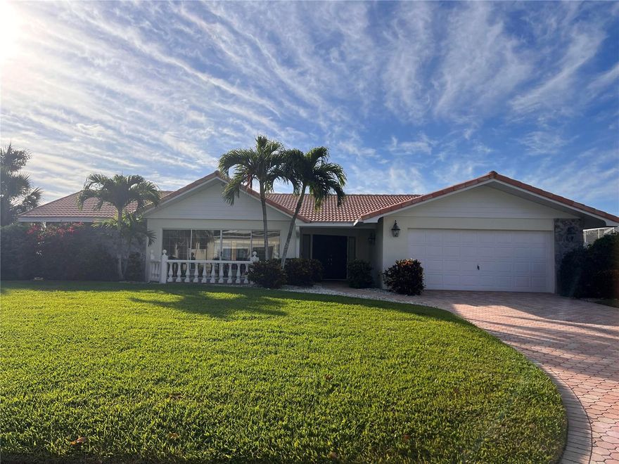 Discover the captivating charm of this 3-bedroom, 2.5-bath canal front home, nestled one lot away from Sarasota Bay in the coveted Country Club Shores. Its unique position near the end of a peaceful cul-de-sac, promises a serene retreat. Boating enthusiasts will appreciate 110 feet of waterfront, complete with a private dock and boat lift. Deeded beach access invites you to the pristine sands of the Gulf of Mexico, all within a community that offers easy access to local amenities