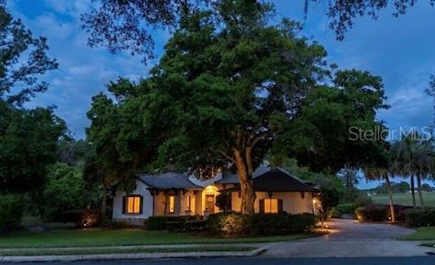 Spacious and beautifully maintained 3-bedroom + den, 2.5-bath home situated on a private half-acre lot backing to serene woods and a golf course—with no homes on either side for exceptional privacy. From the moment you arrive, you’ll appreciate the brick-paver driveway, walkway, and charming courtyard entry leading into a large, welcoming foyer.

Inside, the home features a thoughtfully designed split floor plan, including a Jack-and-Jill secondary bath and a generously sized primary suite with dual closets. The primary bath offers separate his-and-hers sink areas, a relaxing soaking tub, and a walk-in shower.

The kitchen is well-appointed with an island, solid surface countertops, stainless steel appliances, and a convenient built-in desk area, all opening to a spacious living room with high ceilings and elegant crown molding—perfect for entertaining or everyday living.

Step outside to enjoy the expansive brick-paver lanai with a covered area featuring a bar style counter, cabinets, and sink, and opening to a large birdcage—ideal for outdoor gatherings while enjoying peaceful views.

Additional highlights include a side-turned 2-car plus golf cart garage with pull-down attic stairs, a separate laundry room, and durable ceramic tile and laminate flooring throughout—no carpet anywhere. Major updates include a new roof (2025), HVAC system (2017), and water heater (2021), offering peace of mind for years to come.

This home combines space, privacy, and thoughtful upgrades—ready for you to move in and enjoy!