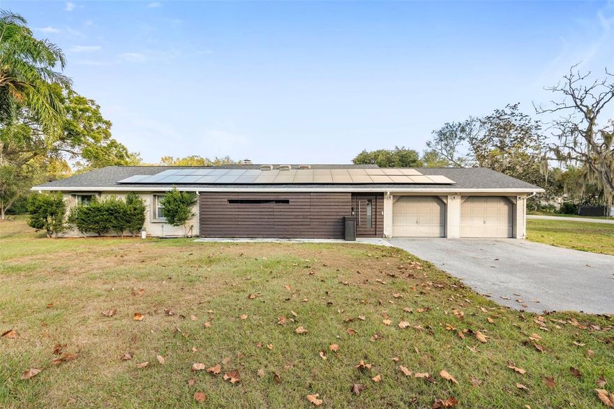 Location, location…plus so much more!

If you’ve been searching for a spacious property close to shopping, dining, and major highways—yet private, quiet, and truly residential—this is the home for you. Situated on just over an acre in a NON-DEED RESTRICTED area with NO CDD or HOA fees, this one-of-a-kind 3/2/2 home offers freedom, convenience, and stunning modern design all in one package.

Inspired by the work of Frank Lloyd Wright, this architectural gem delivers the true WOW factor from the moment you step inside. With over 2,000 sq. ft. of updated luxury living space, this home has been meticulously cared for, thoughtfully upgraded, and is completely move-in ready.

Step into the expansive open-concept kitchen and living area, featuring gorgeous white modern cabinetry, abundant counter space, high-quality appliances (including brand-new cooktop and double ovens), and storage like no other. Skylights and recessed lighting fill the home with natural brightness, while triple sliding doors fold away to create a seamless indoor-outdoor living experience. A newly redone wood-burning fireplace and dry bar make the space perfect for entertaining.

The home features 3 spacious bedrooms and 2 updated bathrooms, including a primary suite with a sleek, modern closet and beautifully refreshed ensuite.

Outside, the fully fenced backyard gives you a clean slate to design your dream outdoor oasis—with plenty of extra acreage if you want to expand the yard further. The property also includes a new 219-ft vinyl fence with two gates, an asphalt driveway, and a whole-house water filtration system.

Additional major upgrades add enormous value:

Owned solar panels that transfer to the new owner—keeping electric costs low

New roof (3 years old)

New HVAC system

Private well and septic for low monthly expenses

All of this is just minutes from Publix, restaurants, and commuter routes—providing the perfect blend of privacy and convenience.

This home is truly one of a kind—a rare opportunity in a highly sought-after location. Come see for yourself everything this masterpiece has to offer.

Call today to schedule your private showing!