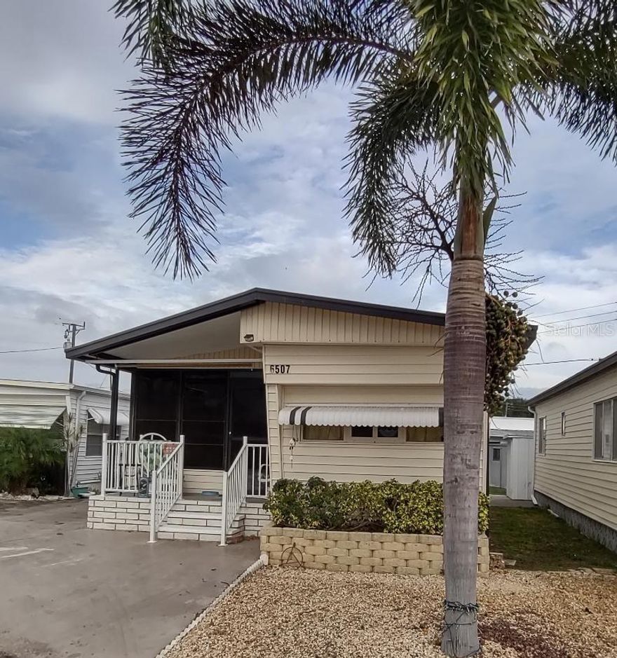 Experience the coastal lifestyle at an affordable price. A spacious screened lanai adds indoor/outdoor living space to your cozy two Bedroom, two Bath Mobile Home in the highly desired active 55+ Trailer Estates community. The primary Bedroom has an ensuite bath and walk in closet. Two sheds (one equipped with a washer and dryer) also provide extra storage. Roof was resealed two years ago. Low park fees and tons of amenities. You own the land. Boaters have direct access to Sarasota Bay from the Marina. Enjoy the large, heated community pool, hot tub, gym and wood shop. The community buzzes with pickleball, shuffleboard, kayaking, horseshoes, bocce, dancing and more. A US Post Office on site. 10 minutes to the SRQ Airport. Convenient to shopping, restaurants, the Arts and everything Bradenton/Sarasota has to offer. Sold furnished.