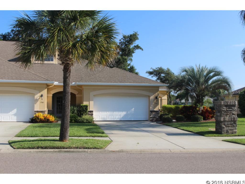 Residences at Turnbull Bay Golf Community. This End unit has so much to offer. Golf Course and Lake Frontage, directly across from clubhouse and pool. Upgraded kitchen with Granite counters and Stainless Steel Appliance package. Beautiful Ceramic Tile throughout except Bedrooms are carpeted. Master Bedroom over looks the lake and golf course and has handicap accessible shower, a jetted tub and large walk in closet. This open floor plan also features a custom book cabinet in 2nd bedroom and kitchen area for added storage. The separate Laundry room has tons of cabinet space. Double Garage, front porch and back brick pavered patio makes this the perfect home. HOA fee includes unlimited greens fees with purchase of Cart. Move in ready! Newer roof! ;Water: City
