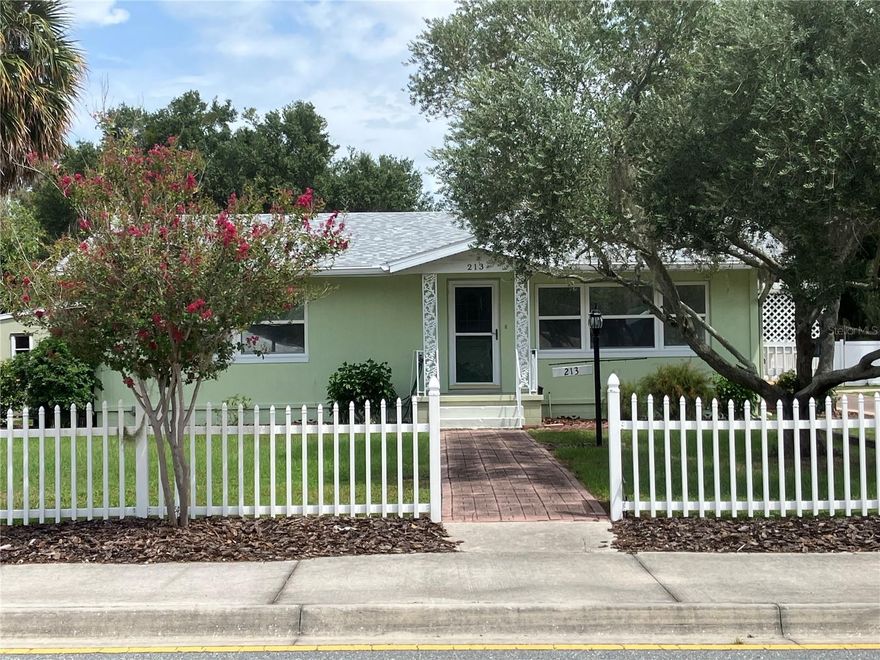 PRICE REDUCTION! Location, Location, Location! Walk or golf cart just two blocks to downtown Tavares and enjoy the restaurants, shops, Wooten Park, sea planes, boat ramp, and views of the Chain of Lakes. Currently Mixed Use Zoning for potential commercial opportunities. New interior and exterior paint. New carpet and flooring.  French doors currently on garage entrance. Second bathroom is located in garage. Screened Porch large enough for entertaining along with outside deck for enjoying the outdoors. Don't pass this opportunity to own this charming home. Bring your offer today!