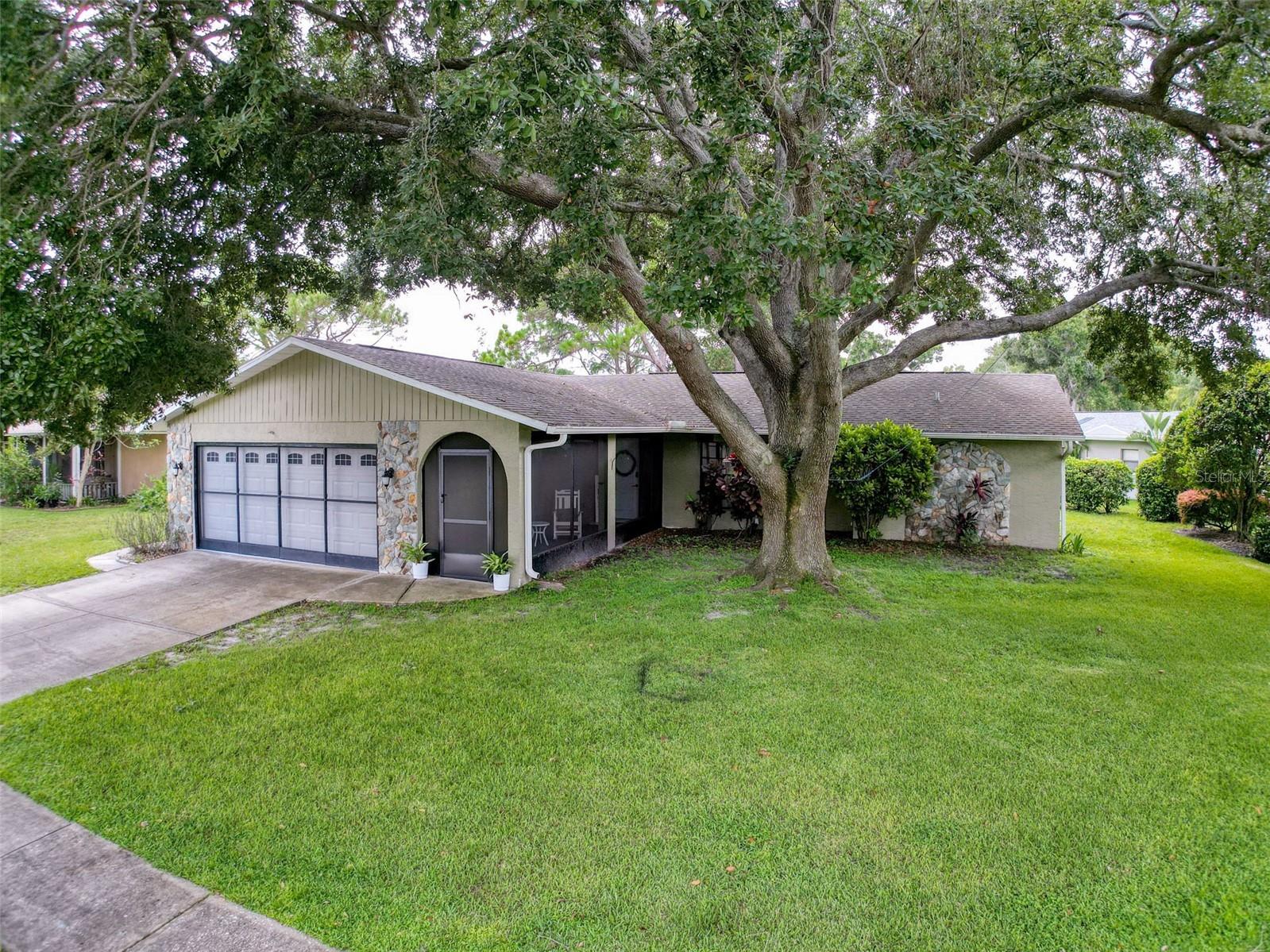 Come check out this beautifully remodeled home in Greenbrook Estates. You will love the open concept living, the vaulted ceilings, and large bedrooms. The living area boasts a beautiful fireplace/tv/storage area, walk in closets/laundry, and pantry. Enjoy the water and wildlife views and/or experience the thrill of a nice catch in the pond right in your back yard. The community pool and clubhouse are a stones throw away and are waiting for you to visit. There is a beautiful oak tree in the front yard to provide plenty of shade for you to enjoy. The garage, screened in front and rear porches, and patio provide plenty of space for you to utilize. Enjoy nearby Mitchell Park, Mitchell Ranch shops, highly rated schools, golf courses, restaurants, and shopping. Tampa and the beaches are within a half hour drive and you can be in Orlando before you know it! Welcome home!