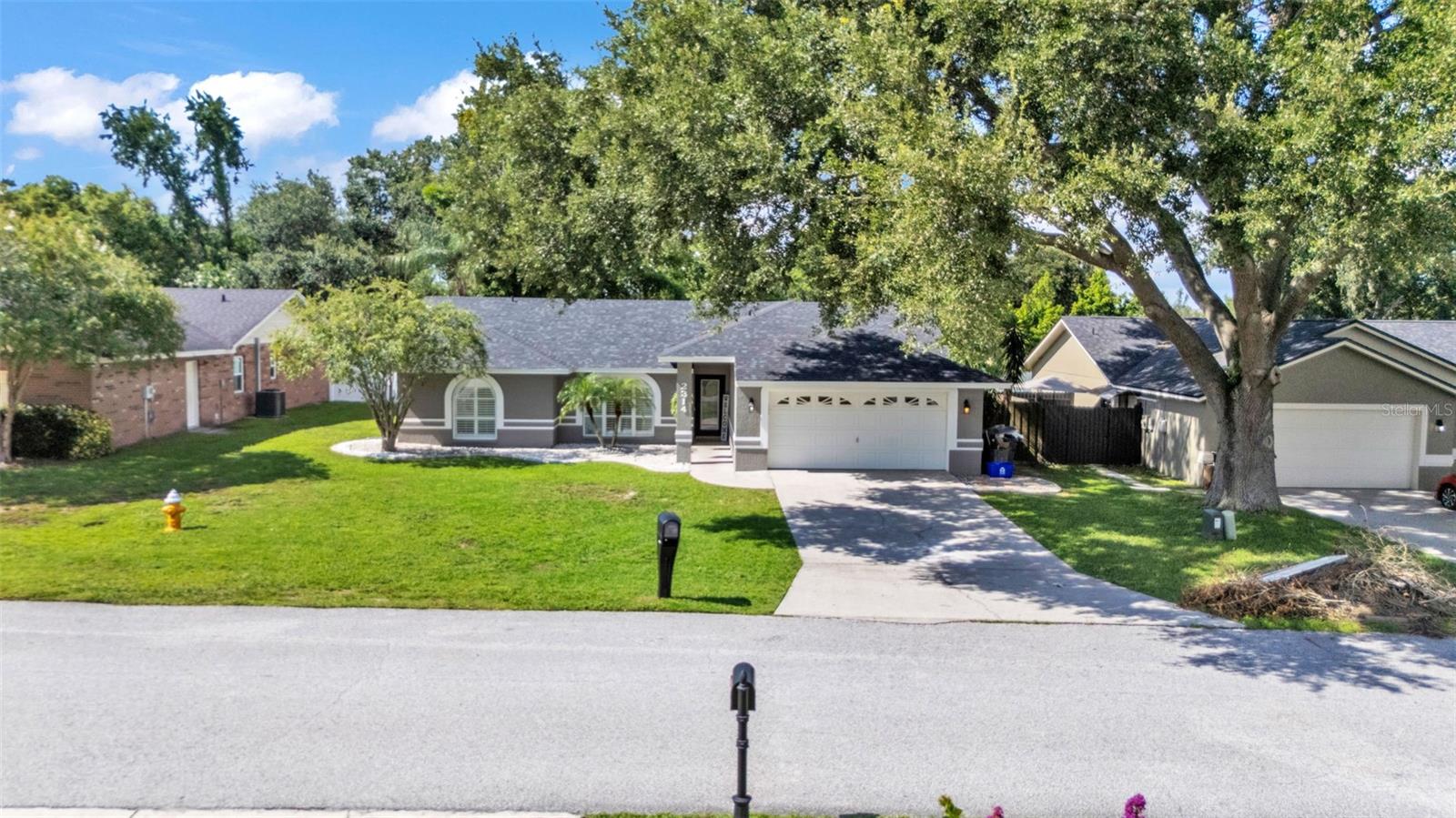 Welcome to your dream home in the heart of South Lakeland! This beautifully maintained 4-bedroom, 2-bathroom residence with an additional office or bonus room is perfectly move-in ready—and packed with features you'll love. Step inside to an elegant kitchen that serves as the heart of the home, featuring granite countertops, stainless steel appliances, stylish tile backsplash, and an abundance of cabinet storage. There’s even space for a dining table, with a seamless view into the wide-open living area—ideal for entertaining or everyday living. Down the hallway, you’ll find three spacious guest bedrooms that share a full bathroom, offering both comfort and functionality. The home’s split floor plan ensures privacy, with the primary suite tucked away for your own personal retreat. Outside, your screened-in back lanai overlooks a sparkling inground pool and a fully fenced, expansive backyard—perfect for relaxing, entertaining, or outdoor play. The tropical landscaping and privacy fencing create a serene, resort-like atmosphere right in your own backyard. Located just minutes from the Polk Parkway, commuting is a breeze, and you’ll love the proximity to Highlands Grove Elementary, Parkway Christian Academy, shopping, dining, and the upcoming Orlando Health campus. With newer wood-look tile throughout, vaulted ceilings, and an abundance of natural light, this home is the perfect blend of style, space, and location. Don't miss out on this South Lakeland gem—schedule your private tour today!