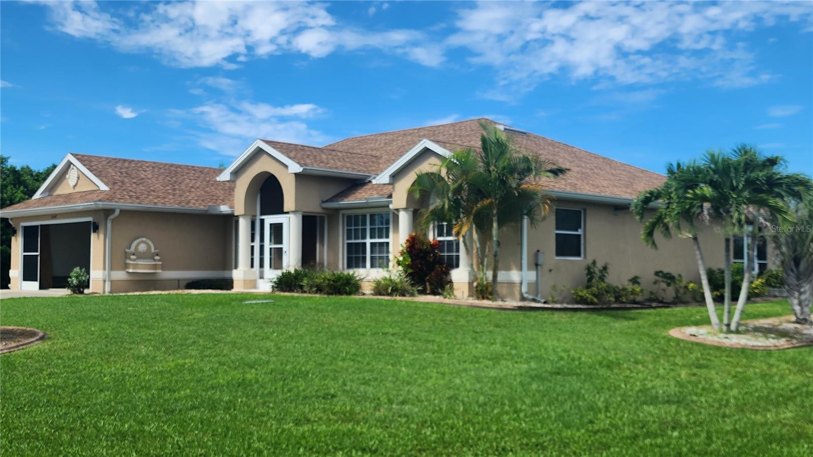 ANNUAL RENTAL available now in South Gulf Cove! This is a large corner lot home with 2,239 sf under A/C offering 4 bedrooms, 2 bath, plus a den/office, formal dining room, dining area as well off the kitchen, laundry room, 3 car garage and a huge paved driveway (addition to paved driveway and all along side of the home) which can accommodate a boat, trailer, RV! This split plan home has a newer roof, large rooms with lots of closet/storage space, den/office, open floor plan, LED lighting, ceiling fan in garage with screens and epoxy floor. 42" wood cabinets in the kitchen, Corian kitchen counter tops, ceramic tile in kitchen, dining area, family room, laundry room. The rest of the house boasts with wood grain tile for an elegant look. Master bedroom has tray ceiling, separate walk in closets. Master bath features garden tub, separate shower and dual bathroom sinks. All bedrooms and family room have ceiling fans along with two ceiling fans on the lanai/porch. Washer and dryer hookups in inside laundry room. Located in the beautiful South Gulf Cove water community with over 50 miles of canals. The home is minutes from the community boat ramp and park with easy gulf access. You can easily bike to the waterfront parks. Close to beautiful Gulf beaches, golfing, shopping and world class fishing. No smoking is allowed in the house. The ideal tenant earns 3 times the monthly rent; has NO history of evictions, the ability to clear the background screening and a good credit history. First and last month rent and Security Deposit of $2400 is due on or before move in. Move in ready! Bring your boat, trailer, RV or toys and enjoy SWFL living in South Gulf Cove!