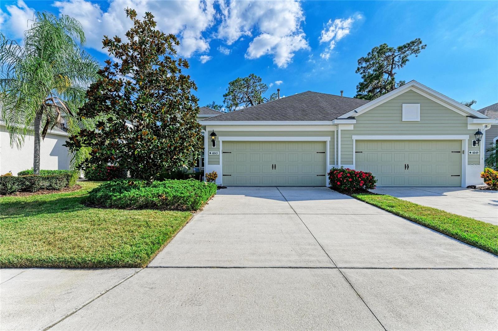 Welcome to this exceptional, beautifully maintained, and updated villa. Tidewater floor plan, the largest villa layout offered by Neal Communities, located in the sought-after, gated community of Silverleaf in Parrish. Enjoy added security and efficiency with newer IMPACT windows and sliders (2019), complemented by plantation shutters throughout for timeless elegance. The open concept living area and bedrooms feature luxury vinyl plank flooring with no carpeting throughout, creating a cohesive and inviting flow. The chef-inspired kitchen is equipped with stainless steel appliances, a natural gas range, center island with breakfast bar seating, and ample pantry space, perfect for both casual meals and entertaining. The adjacent dining area is filled with natural light, ideal for everyday living. The split-bedroom floor plan provides privacy, with the spacious primary suite offering two closets, dual vanities, a large walk-in shower, and a private water closet. The versatile den easily functions as a 3rd bedroom or home office, and the guest suite also includes a walk-in closet for extra storage. Step outside to your screened lanai, surrounded by lush tropical landscaping and no direct rear neighbors, a serene setting for morning coffee or evening relaxation in the Florida breeze. Additional upgrades include fresh interior and exterior paint, updated lighting and ceiling fans, laundry room equipped with Speed Queen Washer/Dryer with upper cabinets, and hurricane brackets on the garage door. Residents of Silverleaf enjoy resort-style amenities including a heated pool and spa, fitness center, playgrounds, parks, nature trails, basketball and soccer courts, picnic areas, and a dog park—all covered by the HOA for easy, low-maintenance living. Experience the best of Florida lifestyle in this vibrant community, schedule your private showing today!