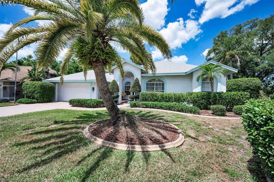 Welcome to this beautiful pool home in Gulf Trace where tranquility meets the comfort of being home! Truly well cared for and immaculate best describes this residence featuring magnificent curb appeal with tropical landscaping and an open floor plan with towering ceilings featuring 3 bedrooms PLUS A HOME OFFICE/ STUDY, 2 baths and 2 car garage. Step thru the front door to an elegant living and formal dining area with views of the beautiful paver deck heated pool and the outdoors, the kitchen is an absolute delight with its extensive cabinetry and granite tops while over looking a spacious breakfast nook and a cozy family room with a gas fireplace, ideal for family and friends to gather and enjoy. Walls of sliders to the pool and additional windows create filtered day lighting. The popular split bedroom plan features 2 large guest bedrooms, one with a built-in desk/ Murphy queen size bed). The owners primary suite is spacious overlooking the expansive outdoors and pool area and comes with 2 walk-ins and a beautiful master en-suite that has it all!. Upgrades include whole home solar panels, a solar heated pool, paver decking at the front entry, entire driveway and the pool area, some updated floorings and appliances, a water softener, a security system, a newer roof, a brand new pool sweeper and much more! Ample closet space, a nice sized laundry room, built-ins for additional storage too.  The pool area is a tropical oasis and the perfect spot to relax and enjoy swimming all year round with a large covered area for dining and a wall of tropical plants and trees for the ultimate privacy. Gulf Trace is centrally located with great proximity to nature parks, walking trails and the Gulf of Mexico as well as the county recreation center and major throughways and conveniences of shopping and dining.