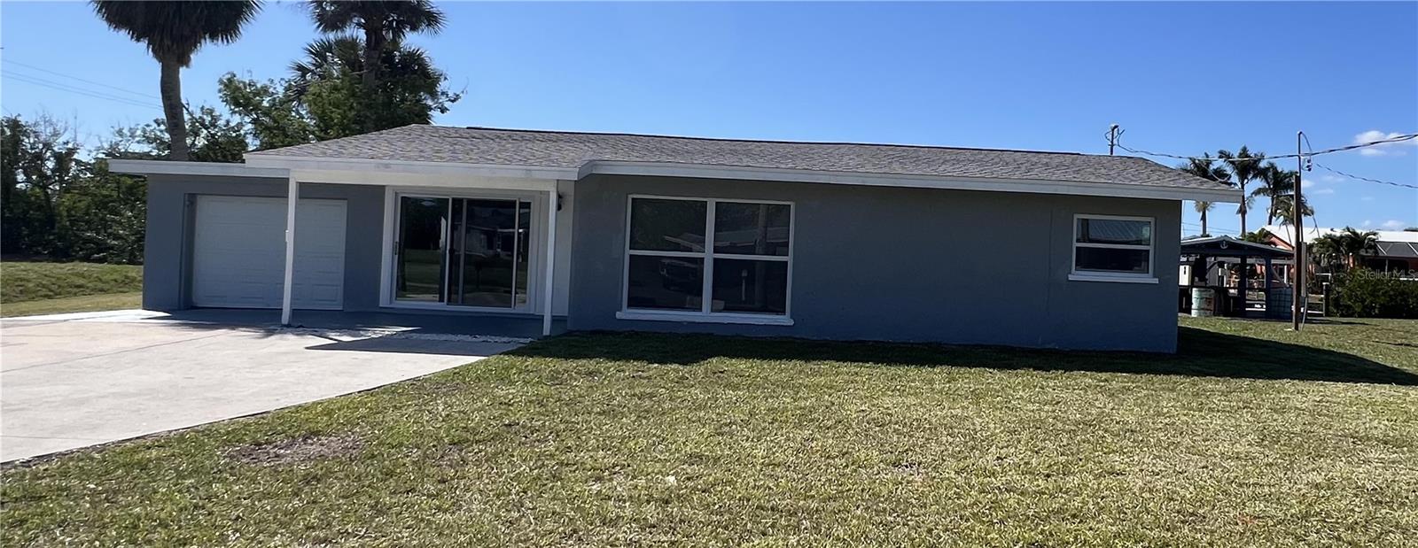 Fully renovated 3-bedroom, 2-bathroom home with a 1-car garage. This property showcases a new kitchen with stainless steel appliances, granite countertops, and new cabinetry. Stylish vinyl plank flooring flows seamlessly throughout, while both bathrooms have been upgraded with new tile, vanities, and fixtures. Additional improvements include a newer roof, hurricane impact windows, and a central A/C system, providing comfort and peace of mind.