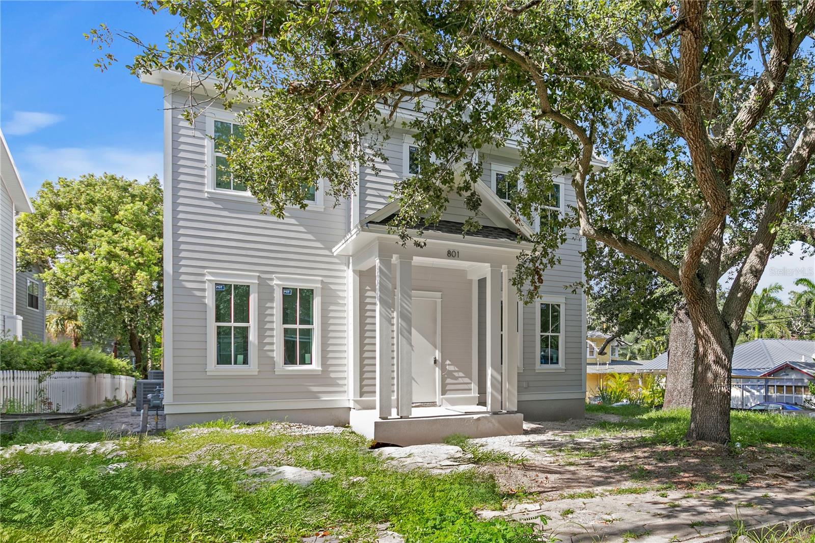 Under Construction. Welcome to 801 9th Ave S, a 2,990 sq ft new construction home by Canopy Builders, perfectly situated in the historic Roser Park neighborhood—one of St. Petersburg’s most charming and sought-after areas. Scheduled for completion in December 2025, this home offers the rare combination of timeless design, modern craftsmanship, and peace of mind in an X flood zone—high and dry, with no storm surge or flooding concerns.
Just minutes from downtown’s waterfront parks, award-winning restaurants, shops, and cultural attractions, the location blends city convenience with the tranquility of a private, tree-lined street. Roser Park’s historic character, winding brick roads, and lush landscapes create an unmatched setting for this thoughtfully crafted residence.
Inside, the open-concept layout balances elegance and livability. The main level features hardwood floors throughout, a glass-paneled office (or fifth bedroom), and a convenient guest suite with a designer-appointed bath. At the heart of the home, the gourmet kitchen shines with Pompeii quartz counters, a dramatic soapstone-topped island, custom cabinetry, and a walk-in pantry with built-ins. A spacious great room and dining area flow seamlessly to the covered rear porch, creating effortless indoor-outdoor living.
Upstairs, a versatile loft anchors the second level. The primary suite offers dual walk-in closets and a spa-inspired bath with quartz counters, custom tile, dual wall-mounted faucets, and a stone-floored walk-in shower. Two additional bedrooms, each with walk-in closets, share a beautifully finished hall bath. A dedicated upstairs laundry room with quartz counters and built-in cabinetry adds convenience.
Every detail has been carefully selected—from premium trim, hardware, and lighting to heritage-style pavers and natural gas service—creating a home that blends modern luxury with enduring charm.
801 9th Ave S is more than new construction—it’s an opportunity to own a luxury home in historic Roser Park, where high ground, timeless architecture, and walkable access to downtown make everyday living both secure and extraordinary.