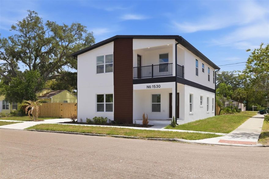 Brand-new 2025 construction just 1.5 miles from Downtown St. Pete — priced under $550K. This 4BR/2.5BA corner-lot home offers 2,548 sq ft of modern living, combining designer finishes, flexible space, and a location that's hard to beat. The open-concept main level features luxury vinyl flooring, quartz countertops, 42" cabinetry, stainless steel appliances, a built-in wine fridge, and a large kitchen island with barstool seating. The first-floor primary suite offers everyday convenience with a private en-suite bath, plus a convenient half bath downstairs perfect for guests. Upstairs, a spacious loft works perfectly as a second living room, home office, gym, or media room, alongside three additional bedrooms served by a full bath situated between them, and a private balcony showcasing downtown views. Outside, the fully fenced yard has room for a pool and is perfect for pets and entertaining, and the private gated parking pad provides secure off-street parking that's hard to find just 1.5 miles from downtown. Walk or bike to Central Avenue, the St. Pete Pier, waterfront parks, museums, and some of the city's best restaurants. Easy access to I-275, Tropicana Field, and Tampa International Airport, with award-winning Gulf beaches just minutes away. New construction at this location and price point won't last long.