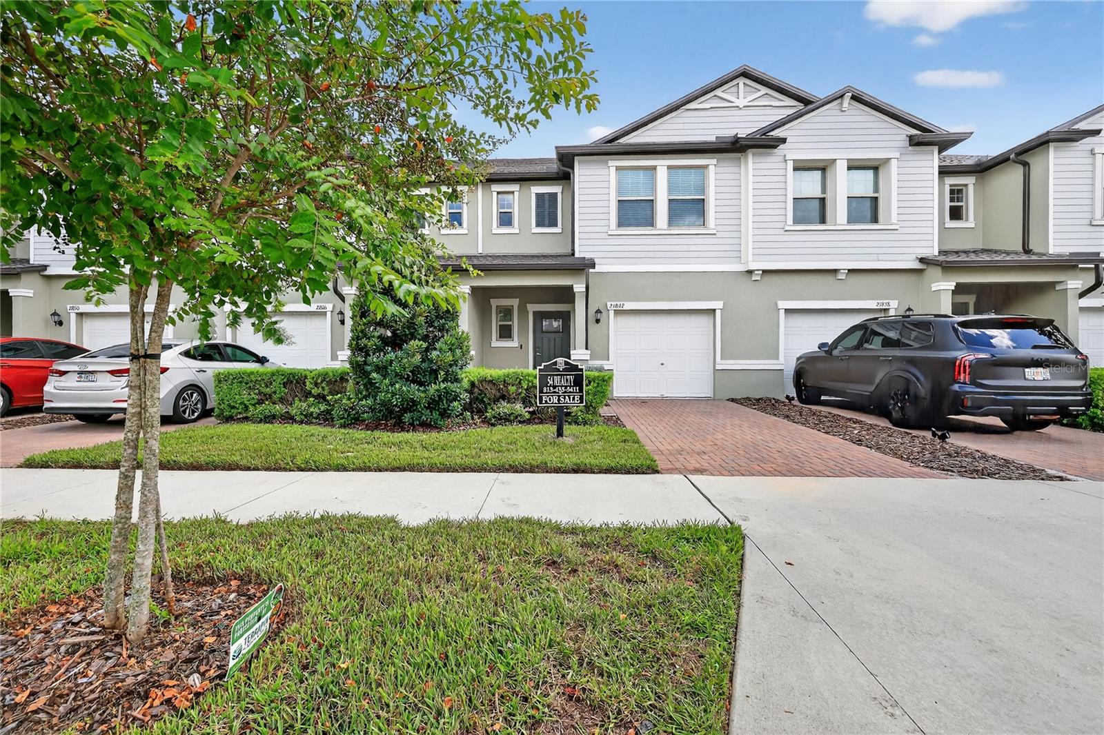 One or more photo(s) has been virtually staged. Welcome to this beautifully maintained 3-bedroom, 2.5-bathroom townhome located in the desirable, amenity-rich community of Connerton in Land O’ Lakes. This spacious two-story residence is designed for comfort and style with energy-efficient features including solar panels and double pane windows to help you save on utilities year-round. Step inside and you’ll find an open floor plan with high ceilings, crown molding, and an abundance of natural light. The gourmet kitchen is perfect for entertaining, featuring stainless steel appliances, quartz countertops, shaker-style cabinetry, a center island, and a walk-in pantry. The primary suite offers a private retreat with dual vanities, a seamless glass shower, and walk-in closet. Enjoy Florida living with a screened-in patio, beautifully landscaped yard, and access to Connerton’s luxury amenities, including resort-style pools, clubhouse, fitness center, dog parks, nature trails, and playgrounds. Additional highlights include a 1-car garage, in-wall pest system, smart home features, and custom details throughout. Conveniently located near top-rated schools, shopping, dining, and easy access to major highways. This home offers the perfect blend of lifestyle and location. Don’t miss your chance to live in one of Pasco County’s most sought-after communities!