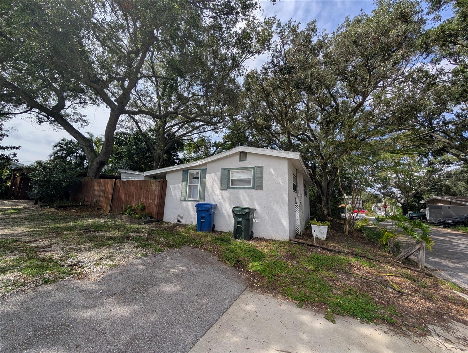 Fabulous Downtown Largo Re-development area with some beautifully new-built craftsman bungalows along cobblestone streets in this rustic, low-traffic neighborhood, surrounded by majestic oakwood trees, walking distance to downtown Largo stores, school, restaurants and bars. No flood, no evacuation zone. Cute 1934-built 2-bedroom 1-bath 667 htd. sqft. frame home features newer windows, doors & "Goodman" A/C in 2015, Hot Water Heater in 2014, stackable washer/dryer in back closet next to back entrance, 125-Amp Cutler-Hammer Electric Panel Box with copper wiring in 2008, Modified Bitumen Roof in 2012, & a quaint screened front entry porch. Home will need remodeling inside (i.e. bathroom, bedroom carpets) & improved landscape outside. All fenced in 49 x 59 lot with storage shed in most desirable area with lots of character. Property was treated for drywood termites and is strictly sold AS IS - conduct inspections BEFORE you sign the contract! See Wind Mitigation and 4-Point Insurance Inspection reports, Turner Pest Control Information in MLS attachments.