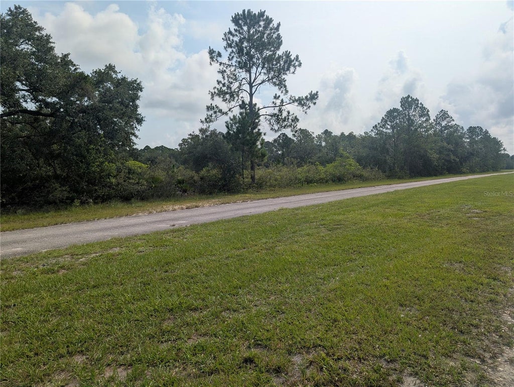 Photo of 810 Palm Avenue, Indian Lake Estates, FL 33855 (MLS # P4939426)