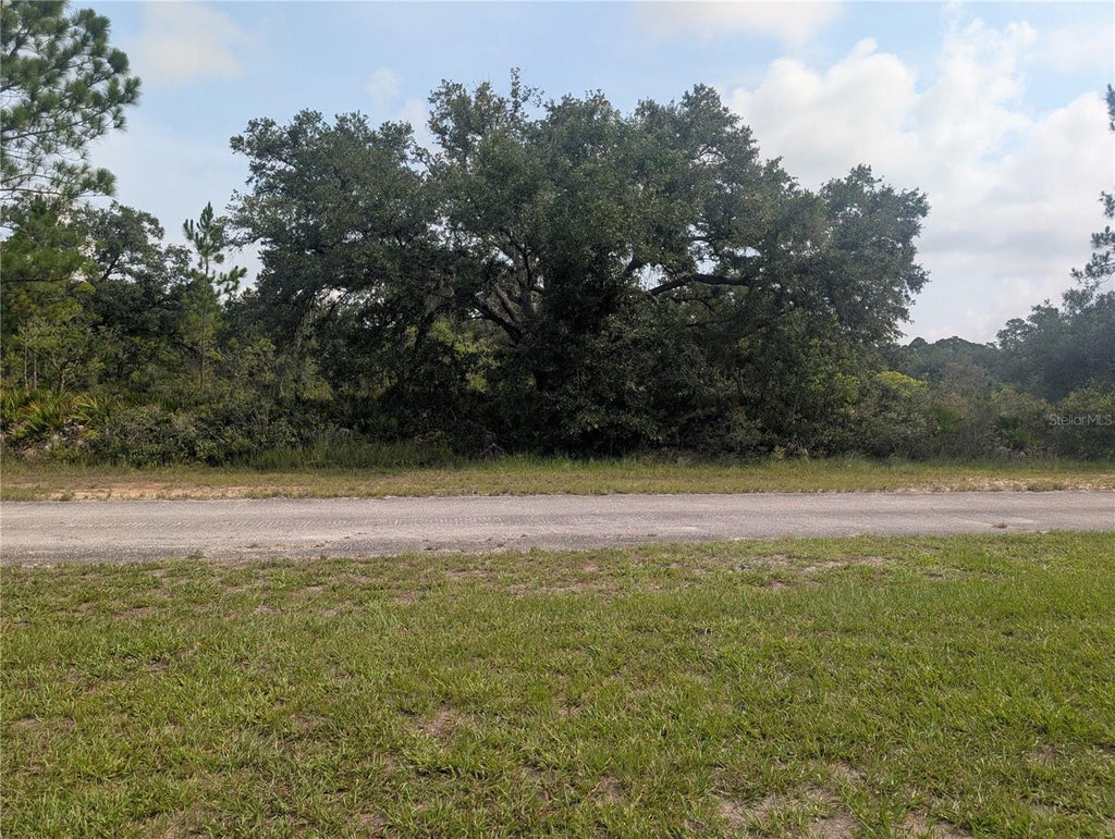 Photo of 810 Palm Avenue, Indian Lake Estates, FL 33855 (MLS # P4939426)
