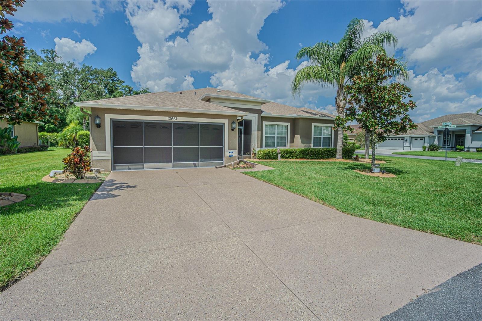 SPECTACULAR NEW LISTING in Clubhouse Preserves is READY for you! This ONE OWNER home with the Rosewood Grande floorplan, built in 2012 is perfectly situated on a .23 acre, PREMIUM corner homesite in the highly sought-after Tampa Bay Golf & Tennis Club. Surrounded by mature landscaping and tucked away in quiet seclusion, this 55+ community boasts world-class amenities including two golf courses, a grand clubhouse with restaurant and pub/grille, resort-style pool and spa, fitness center, theater/auditorium, billiard and card rooms, arts and crafts studio, library, lighted tennis and pickleball courts, shuffleboard, dog parks, planned onsite activities and entertainment and offsite trips and excursions! Great curb appeal with concrete landscape curbing, lush lawn and Screened front entry for cross breezes from Florida room greets you. Stunning Double leaded-glass front doors welcome you into a spacious foyer with ceramic tile, while luxury vinyl plank flooring extends through the main living areas. Natural light flows in through solar tubes and added recessed lighting enhances the bright and airy atmosphere. Gormet kitchen is a favorite and is functional, featuring staggered 42” cabinets, a center island with granite counters, breakfast bar, stainless steel appliances (smooth top range, new microwave 2023), and a spacious breakfast nook overlooking the family room. Entertaining is effortless with the open formal living and dining combo, plus French doors leading to the extended, enclosed, air-conditioned sunroom with slider windows—perfect for year-round relaxation! The spacious owners suite is your private retreat... situated at the rear of the home with access to Sunroom and bath ensuite boasting dual sinks, water closet, soaking tub plus separate shower, large walk in closet and linen closet. Flexible den/office with double doors off foyer provides extra space to suit your lifestyle as a home office/den or flex room. Secondary guest bedroom and bath are on a separate wing for privacy at the front of the home for privacy. Additional highlights include: Separate interior laundry room with washer & dryer, Screened 2-car garage with attic access & metal shelving, Faux wood blinds throughout, 8x8 backyard grilling pad. Upgraded lighting & sprinkler system with new control panel, water softener leased by Blair water systems and the big updates are DONE for you: NEW ROOF (2024), AC (2020), plus appliances updated as recently as 2023. This beautifully maintained 2311 square foot home is ready for its new owners to enjoy the resort lifestyle that Tampa Bay Golf & Tennis Club is known for... to live like you’re on vacation every day! Located North of Tampa for easy access to Wesley Chapel, Orlando, Shopping, restaurants, major highways for easy commute to airports and the Beaches! CALL TODAY!