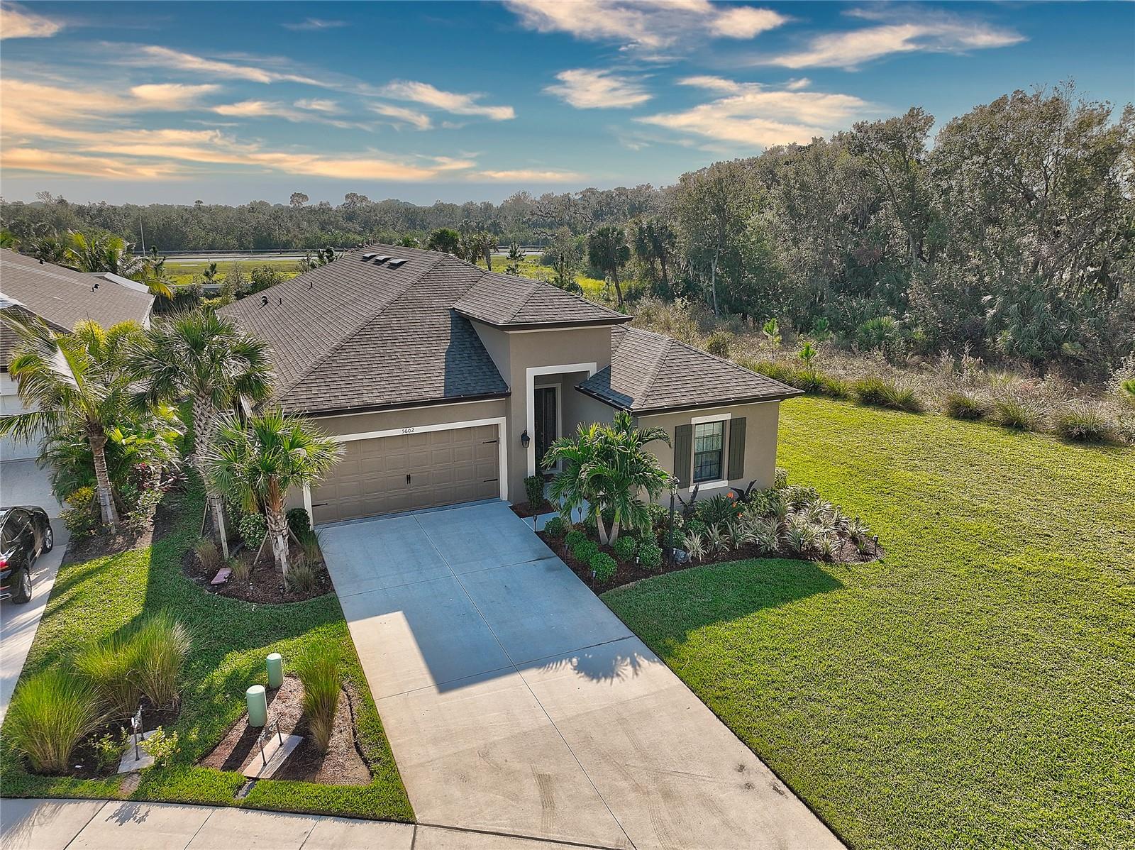 TURNKEY - Come home to this luxurious 4 bedroom +1 flex room and 3 bathrooms! Oversized lot with a beautiful view! Located in the highly desired community of Grandview at the height! Built by Taylor Morrison. The most notable floor plan is Antigua with lots of updates. You will love cooking in this beautiful chef's gourmet kitchen that overlooks the family room. This chef's space offers Quartz countertops, a glazed ceramic backsplash, designer solid wood cabinetry, a hand-free faucet, a 3-stage water filtration system, a gas cooktop, a built-in oven, and a large pantry. Enjoy dinner in the formal dining room with a park view! Your own oasis with a primary suite that offers a beautiful view of the beautifully manicured backyard, lots of natural light, and a gigantic closet! An upgraded walk-in shower with a built-in bench and frameless glass enclosure, and a bathtub perfect for an in home spa experience! Three guest bedrooms offer privacy and plenty of room. Anti-bacterial room fans and bidets are installed in every bathroom. High-quality Merv 13 Air Filter and Low VOC paint, smoke and carbon monoxide detectors, and termite protection. Gorgeous porcelain tile floor and popular luxury vinyl plank throughout. 8-foot doors throughout the house, rounded corners, and alluring light fixtures! Enjoy Florida's weather all year long on your lanai next to the nature park. Your new home also has space to add a beautiful inground pool, the owner has already had blueprints drawn up for it! Or you can soak up the sun in the lush community pool that’s only a short walk away! Watch sunsets, and absorb the Florida sun in the community pool only minutes away! UTC, Fresh Market, Whole Foods, or many restaurants in the area. 13-15 miles away from the famous Siesta Key, Lido key, Coquina, and Holmes beaches and easy access to the airport.