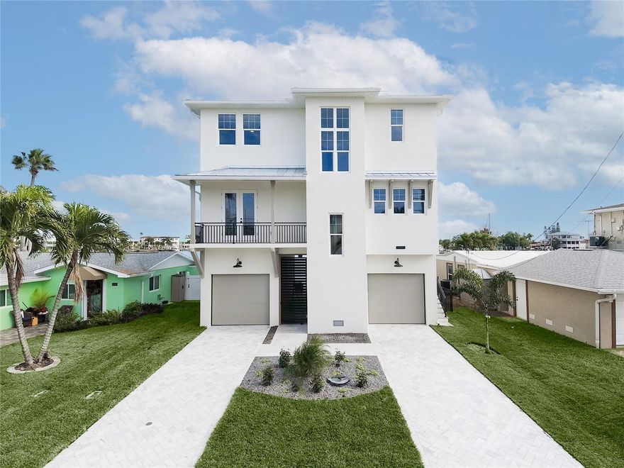 Step inside this newly constructed luxury single family waterfront home, and take a journey through a world of quality craftsmanship and thoughtful design. This isn't just any house; it's a testament to the vision of an architect who created a truly exceptional living space. As you approach, you'll immediately notice the quality construction – this home is built to stand the test of time, with concrete block walls and poured concrete balconies that exude strength and durability. Every inch of this home reflects meticulous attention to detail and a commitment to top-notch materials. Inside, the design unfolds before your eyes, and you'll quickly realize that this is a custom-built gem, far beyond the standard builder-grade homes. Enjoy spectacular water views from every room of the home! The four bedrooms and four bathrooms offer space and comfort for your family and guests, ensuring everyone has their own private sanctuary. But what truly sets this home apart are the luxurious touches that define it. The main-floor laundry room, equipped with an LG Styler, adds convenience and a touch of opulence to your daily chores. And if you prefer, there's a second laundry closet on the top floor for added convenience. As you move through the house, you'll discover the elevator that effortlessly glides you between the floors – a thoughtful addition for your comfort and accessibility. Plus, there's a car lift that can safely hoist your vehicle, water toys, or storage needs, showcasing the home's commitment to modern living. The kitchen is a chef's dream come true, with a hidden pantry and an island design that incorporates a banquet, inviting family and friends to gather, cook, and create memories together. It's not just a space to prepare meals; it's a place to connect and entertain. Step outside, and the entertainment possibilities continue to impress. A breezeway leads you to your covered outdoor living space, complete with a sparkling pool and relaxing spa. It's the perfect spot to host gatherings, soak up the sun, or unwind in the evenings. Beyond the backyard lies a boater's paradise – the protected sailboat-depth water ensures the safety of your boat, and with its strategic location, you can access the Gulf of Mexico in a short, bridge-free boat ride. In essence, this home is a symphony of quality, design, and functionality, harmonizing the best elements of luxury living. It's not just a house; it's an experience waiting to be explored, appreciated, and cherished. Come and see for yourself how this home can redefine your idea of living, and let it inspire your dreams of a life well-lived.