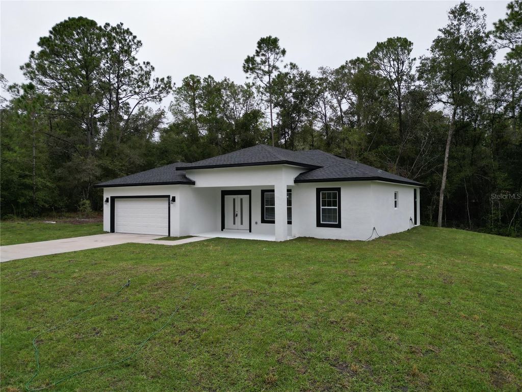 Photo of 8818 N Circular Way, Citrus Springs, FL 34434 (MLS # O6355098)