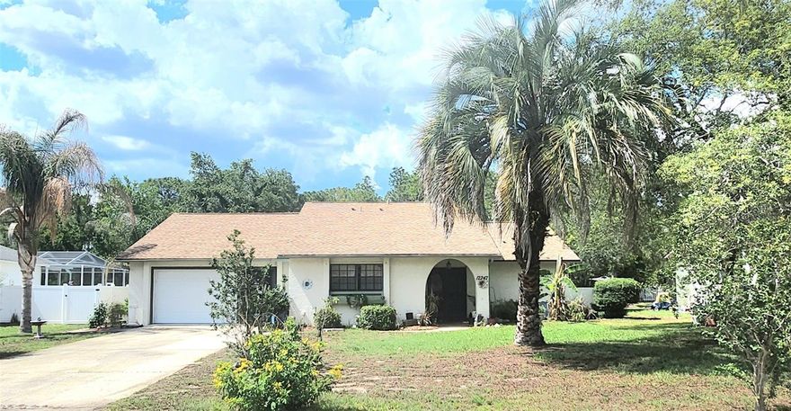 Move-in Ready! Skip the stress of renovation projects and step right into this exceptionally well-maintained, turn-key single-family home in the heart of Spring Hill. Offered by its long-term owners, the pride of ownership shines through every corner of this clean, move-in-ready residence. Offering 1,622 sq ft of pristine living space under a solid block construction, this 1983 classic is immaculate and entirely ready for its next chapter. The open layout seamlessly bridges the living and dining areas, anchored by a bright kitchen that looks out across the living space. Down the hall, you will find a spacious layout featuring a dedicated primary suite, an indoor laundry zone, and a versatile bonus room/3rd bedroom setup. While featuring its classic, original finishes, every inch of the home has been kept in stellar, spotless condition. The property sits on a premium 0.23-acre parcel backing up to a quiet conservation area, ensuring a peaceful, silent sanctuary from your rear lanai. Mature backyard garden throughout. Property is being sold fully furnished and with contents as pictured. No HOA or CDD restrictions mean freedom to live your Florida lifestyle your way.