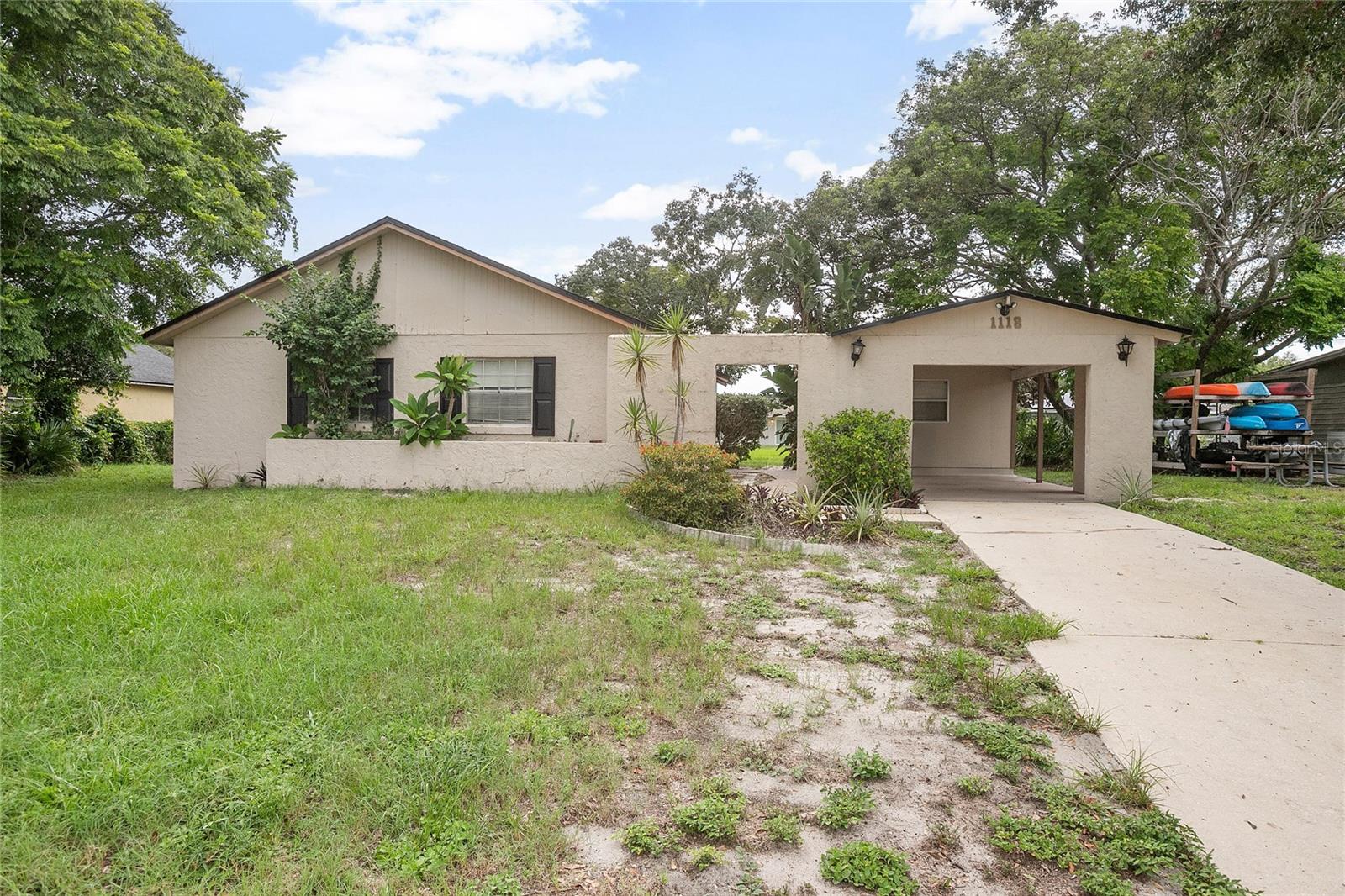 Charming Starter Home in Prime Deltona Location! Looking for the perfect starter home in a great location? Look no further! This well-maintained 3-bedroom, 2-bathroom home is ideally situated near shopping, major roadways, and public transportation—everything you need is just minutes away. Step inside and enjoy the natural light that pours in through large glass sliders, opening into a spacious great room that's perfect for relaxing or entertaining. The home sits on a generous 0.23-acre lot and features an inside laundry room for added convenience. Enjoy outdoor living on the covered rear porch, and take advantage of the 13x8 powered workshop—ideal for hobbies, storage, or DIY projects. Recent Upgrades Include: New Roof (2019), New A/C System (2022), Updated Electrical (2022). Don’t miss out on this fantastic opportunity to own a bright, functional home in a desirable area of Deltona!
