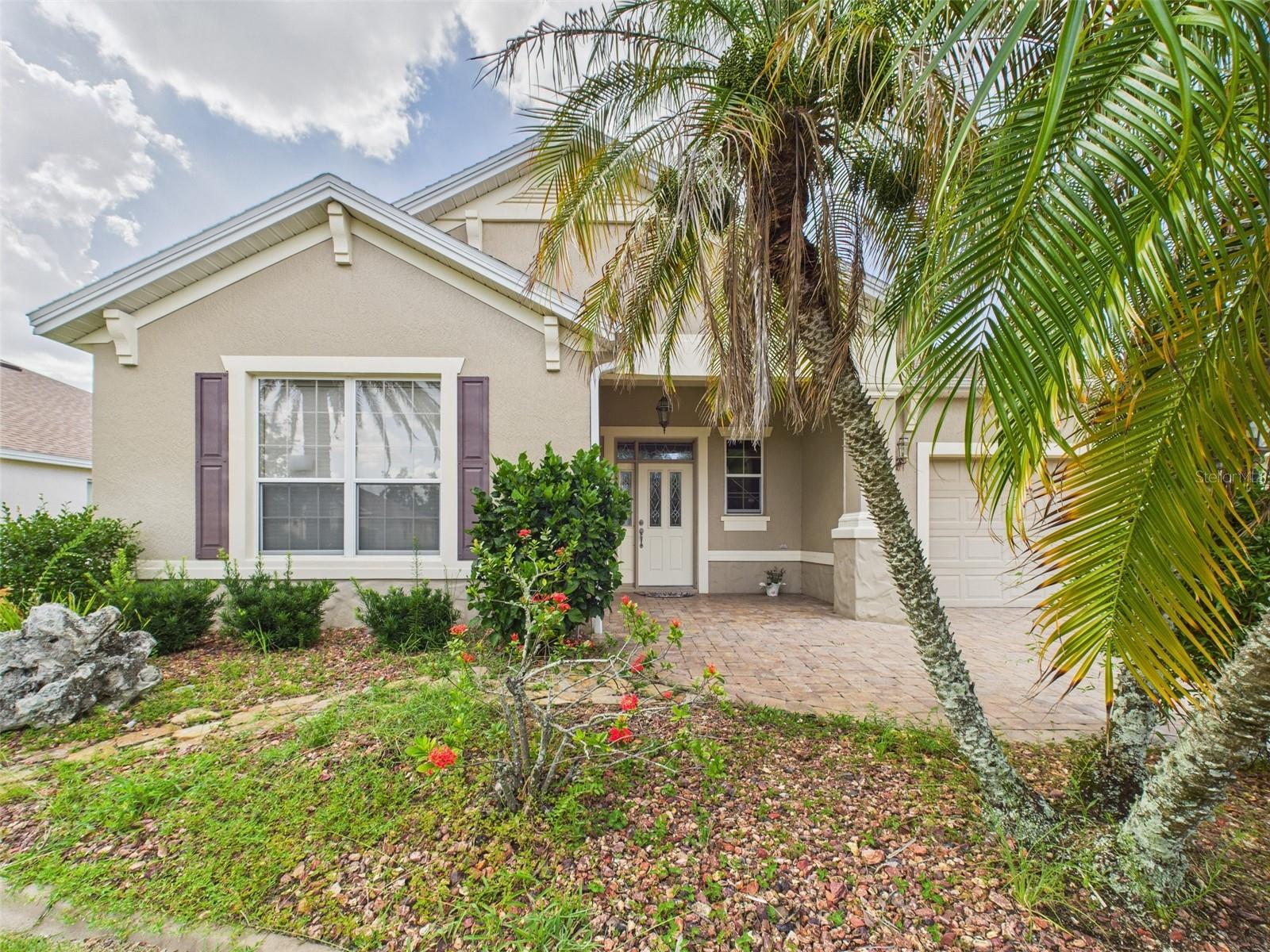MOVE-IN READY IN THE VILLAGES! Welcome to this beautifully maintained south-facing block & stucco Somerset home in the highly sought-after Village of Mallory Square. Nestled on a peaceful cul-de-sac, this property offers enhanced privacy and a quiet street experience. With a BOND PAID, a new roof (2023), and HVAC (2020), this home is ready for you to enjoy worry-free living with maximum Florida sunshine. Step inside to find freshly painted, light neutral interiors, crown molding, and elegant window treatments throughout. The open floor plan flows seamlessly through the living, dining, and kitchen areas, perfect for both everyday comfort and entertaining. The upgraded kitchen features granite countertops, cherry cabinetry, stainless appliances, a tumbled stone backsplash, pendant lighting, pantry, and a second water heater. The primary suite boasts a spacious bedroom with lighted ceiling fan, a walk-in closet, and an ensuite bath with dual vanities, a walk-in shower, separate water closet, and linen storage. Guests will appreciate the privacy of two additional bright and airy bedrooms and a full guest bath. Enjoy Florida living on the south-facing enclosed lanai with stacking sliders, extending to the birdcage and pergola-covered patio, a perfect setting for outdoor dining and relaxation. The landscaped backyard offers both beauty and abundant sunshine. Additional highlights include an indoor laundry room with washer/dryer, cabinets, deep sink, folding counter, and a whole-house vacuum system. The oversized attached garage has an epoxy floor, ample storage, a workbench, golf cart space, extra fans and lighting, and a second deep sink. As a resident of The Villages in Sumter County, enjoy world-class amenities including a clubhouse, community mailbox, dog park, gated community (no guard), golf courses, pools, restaurants, special community restrictions, wheelchair accessibility, a community pool, and lake access. Conveniently located near Mallory Square Community Pool, Coconut Cove Rec Center, Mallory Hill Country Club & Restaurant, and just minutes by golf cart to Lake Sumter Landing for dining, shopping, and nightly entertainment. Seller financing and private financing available. Do not wait, this home will NOT last long!