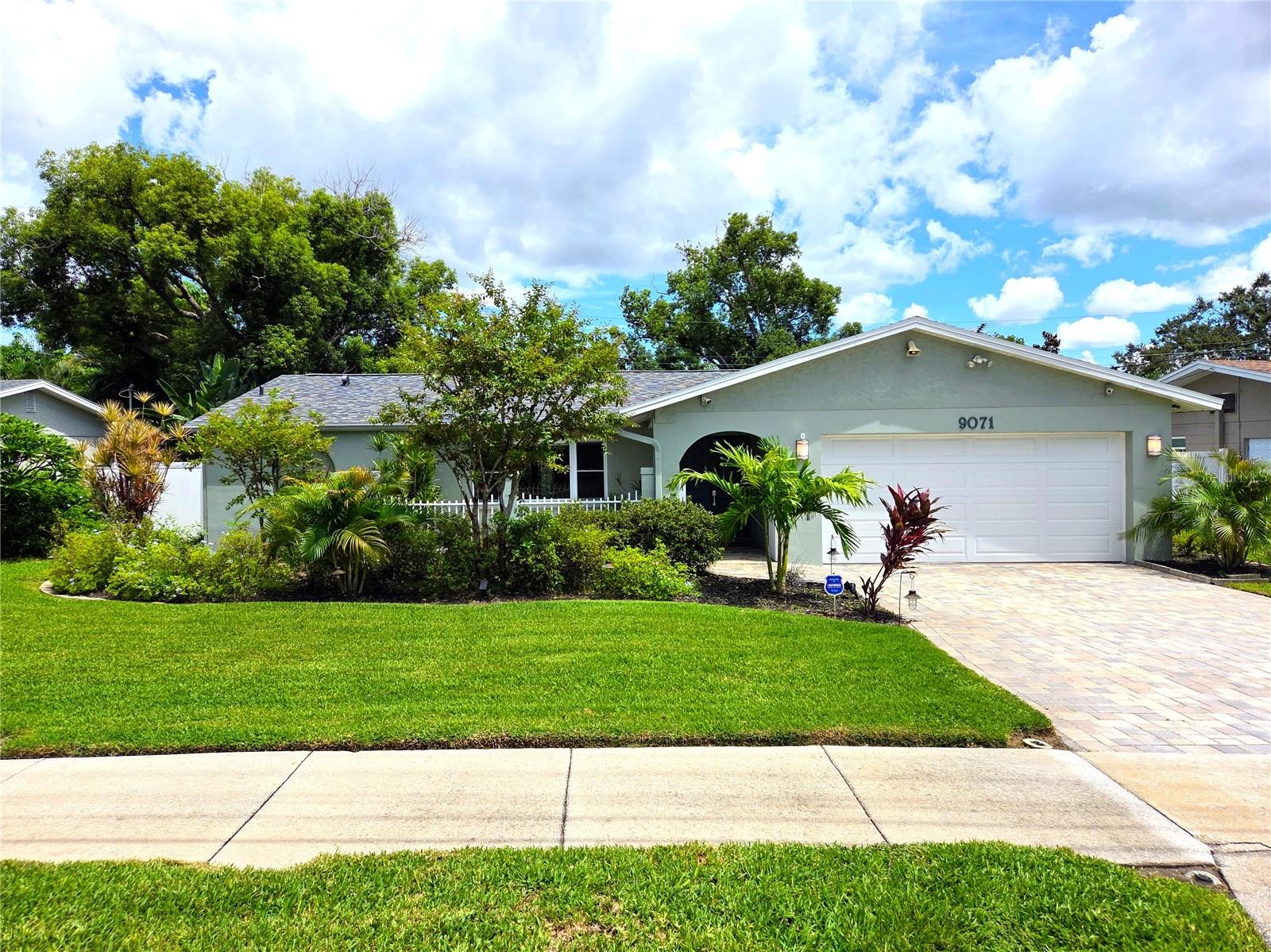Beautiful home in Seminole available for Annual Lease. This charming home has been updated throughout and offers a lot of curb appeal and a desirable location near great schools, shopping and more. The bright and spacious home features tile floors, vaulted ceilings and lots of open welcoming space. The open concept with Living Room and separate Dining Room center around the handsome Kitchen with light wood cabinets, stone counters, stainless appliances and plenty of storage and prep space. The split floor plan features three bedrooms with the main bedroom on one side featuring a custom designed walk-in closet and en-suite bathroom. The other two bedrooms located on the opposite side share a spacious bathroom. Enjoy the lovely fenced yard with tropical landscaping and pavered patio with beautiful arbor to entertain family and friends, the pavered drive and two car garage. A new roof was installed in 2023 and also a new HVAC. Additional upgrades include hurricane-resistant new garage door, and front door and newer windows. The 2-car garage includes a washer, dryer, work bench and electric car charging outlet. There are two sheds with electricity and one has AC. Near Seminole City, beaches, shops and restaurants. Security deposit one month rent. Application fee $65 per adult, tenant processing fee $100. Two pets up to 35 lbs with owner approval. Renters to pay renters insurance and benefits package at $45 month. Rent includes lawn care.