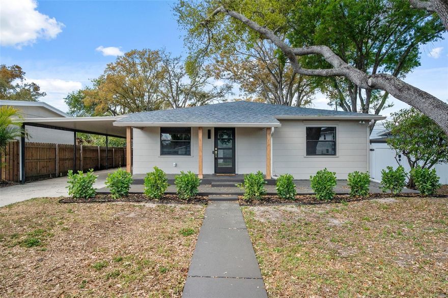 Welcome to this charming 3-bedroom, 2-bathroom home in St. Petersburg, complete with a carport and located outside of a flood zone for added peace of mind. From the moment you arrive, you’ll love the inviting covered front porch — the perfect spot for sipping your morning coffee and enjoying the Florida breeze. Step inside to a welcoming formal dining room that flows seamlessly into the beautifully updated kitchen. The kitchen features new stainless steel appliances, new stone countertops, and new cabinetry, along with a charming dry bar complete with a wine fridge — ideal for entertaining. The kitchen opens into an additional dining area that transitions effortlessly into the cozy living room, highlighted by a fireplace and vaulted ceilings that create an open, airy feel. Toward the back of the home, you’ll find the spacious primary suite, offering a private retreat with its own en-suite bathroom and walk-in closet. Near the front of the home are two well-sized guest bedrooms and a stylish guest bathroom, providing both comfort and functionality for family or visitors. Step outside to a fully fenced backyard, perfect for hosting gatherings, letting pets play, or simply relaxing and enjoying the Florida sunshine. For peace of mind, this home has a brand-new roof (2025), a new HVAC system, and a 2024 water heater. The home has also been completely rewired and features a new electrical panel. Conveniently located less than 20 minutes from the nearest beach, under 25 minutes to downtown St. Pete, less than 30 minutes to The Dalí Museum, and close to great restaurants and shopping, this home offers the perfect blend of updates, charm, and location.