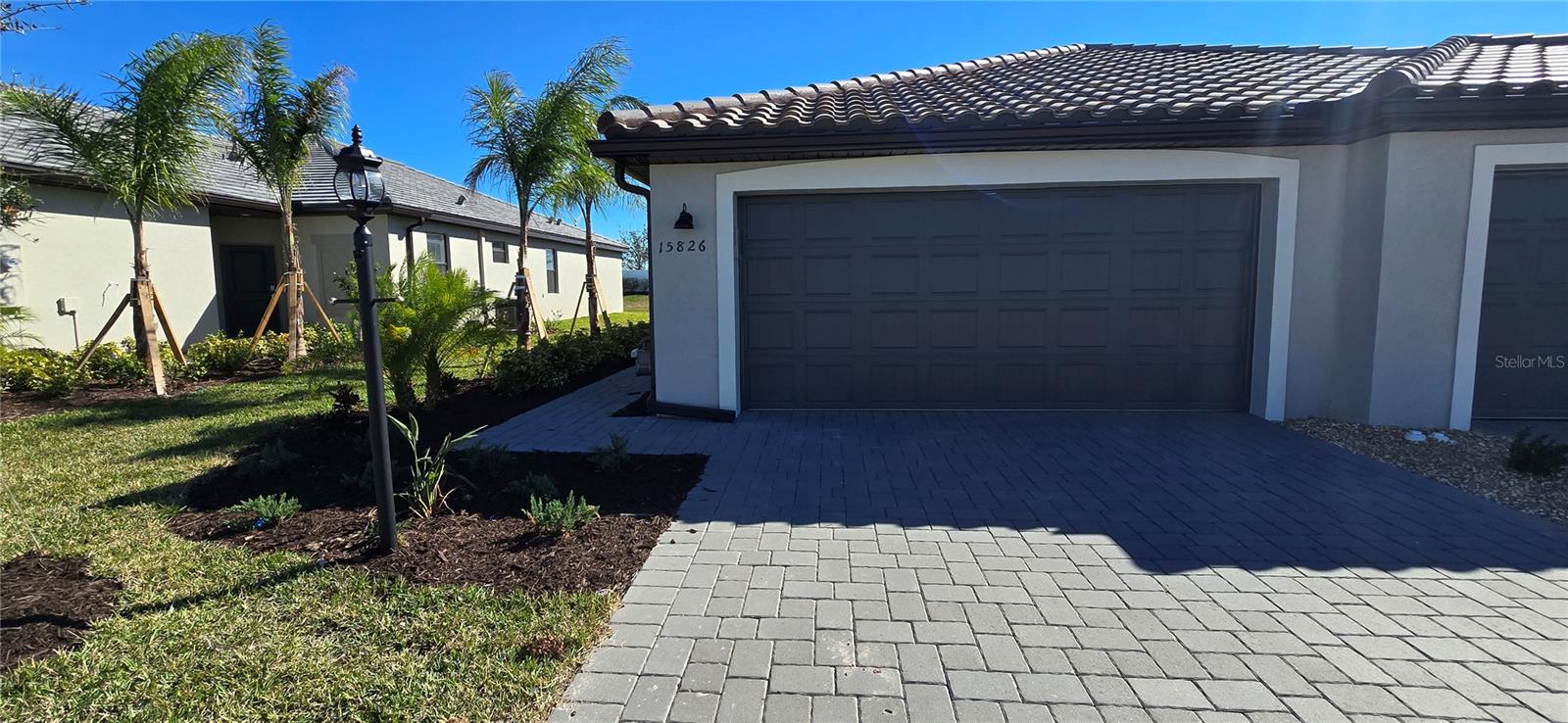 Brand new Lorraine Lakes Villa. 2 Bedroom, Den and 2 Baths. Tile Floors throughout the home. Screened in Lanai. Keyless entry, Quartz counter tops. All appliances included.